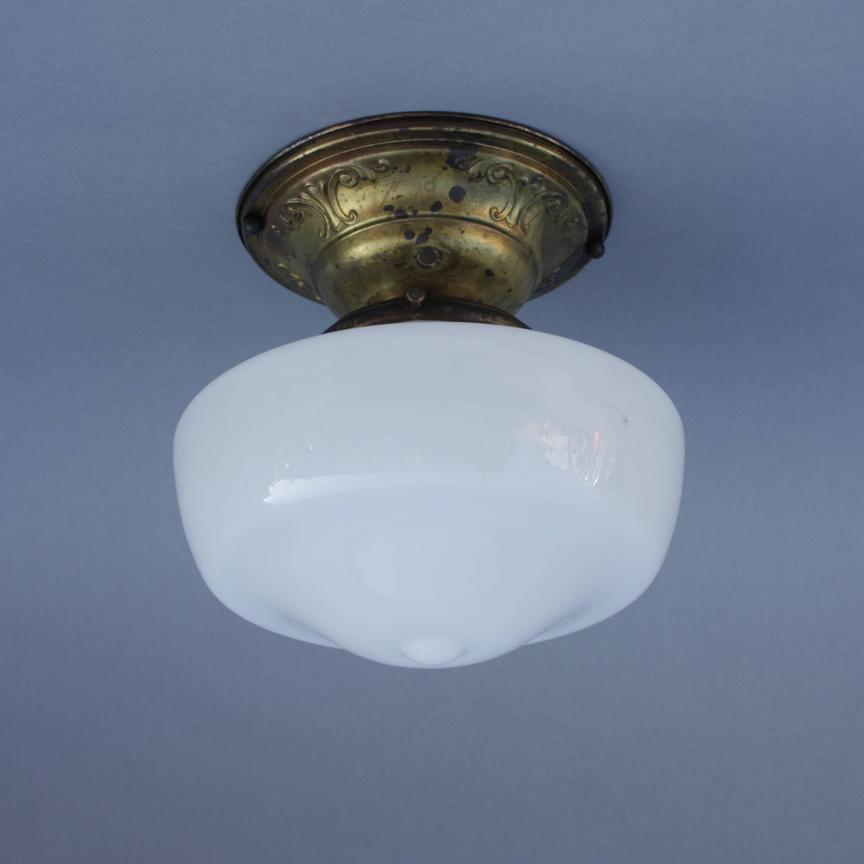 1920s ceiling light fixture with original milk glass globe and ceiling fitter.