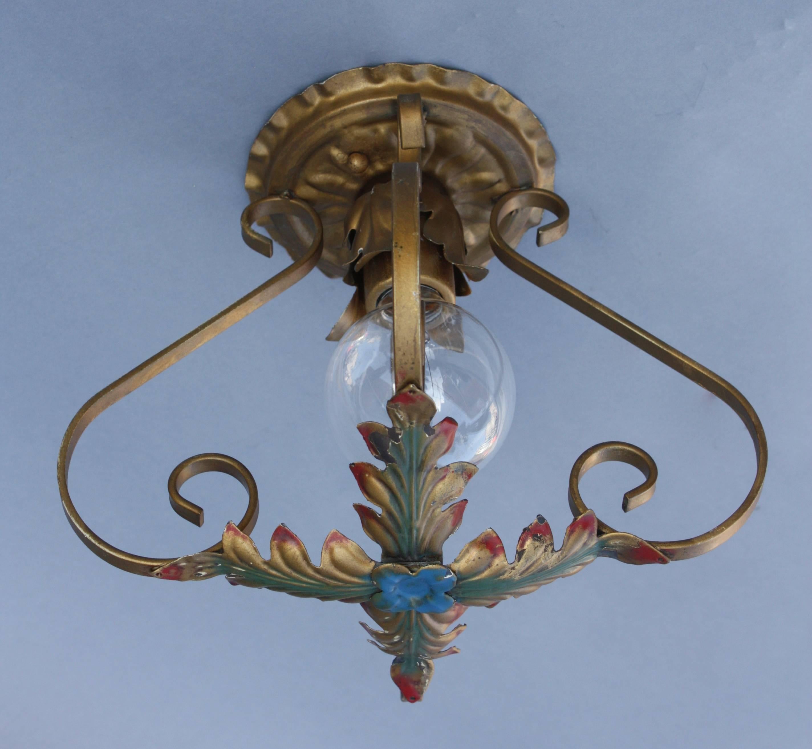 Spanish revival ceiling mount with polychrome finish.