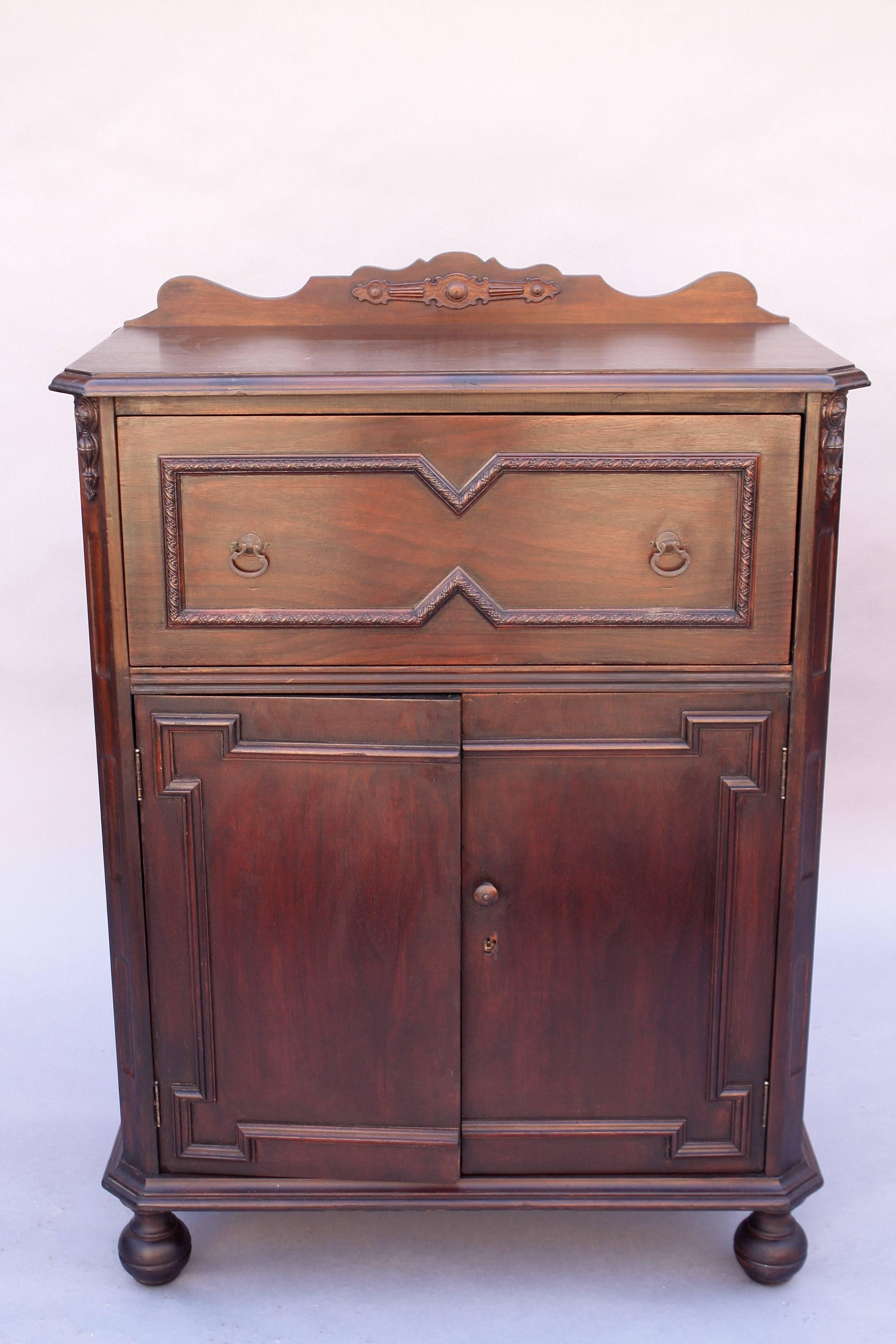 Writing desk with drop down front and lots of storage. Attributed to the Angeles Furniture Company, circa 1920s.