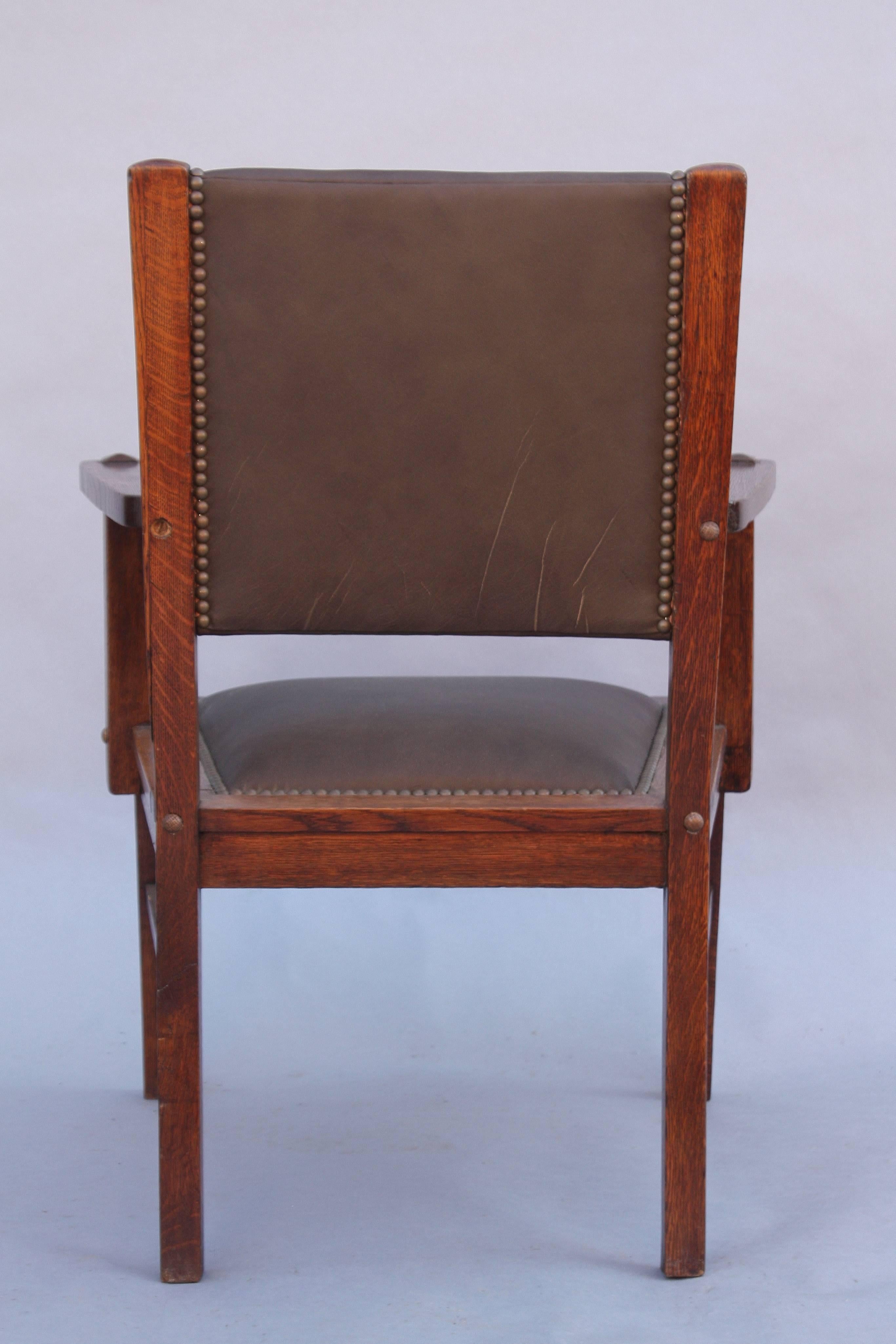 Oak craftsman era chair with new riveted leather upholstery, circa 1910. 35