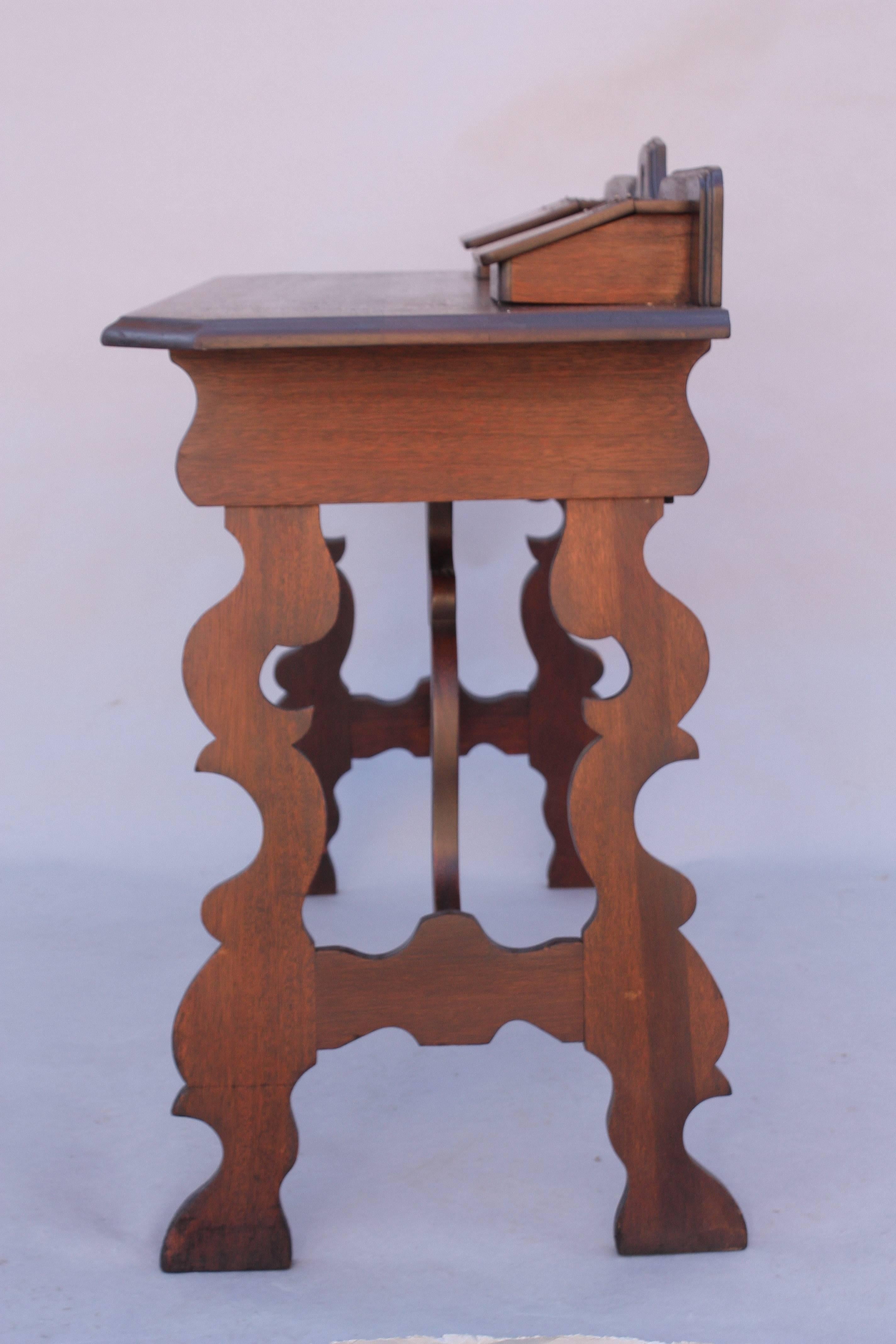 Beautifully designed writing desk with carved lyre legs. Double compartments and drawer for extra storage, circa 1920s.