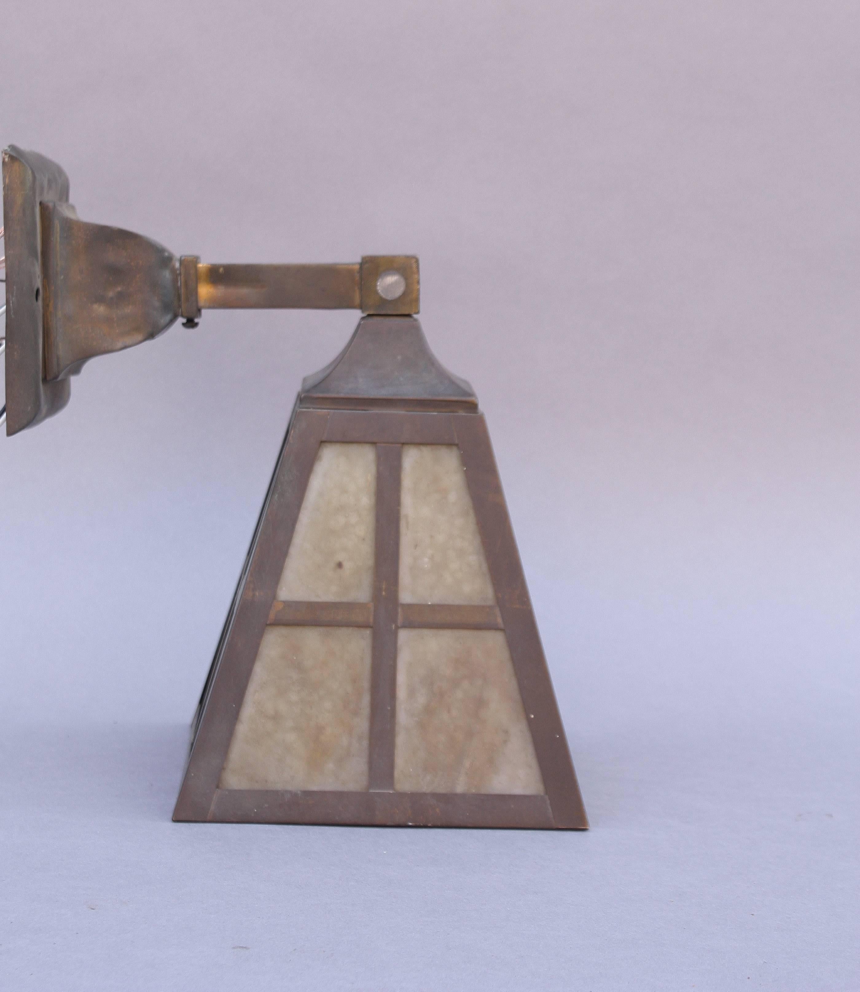 1910 wall mount fixture with slag glass.