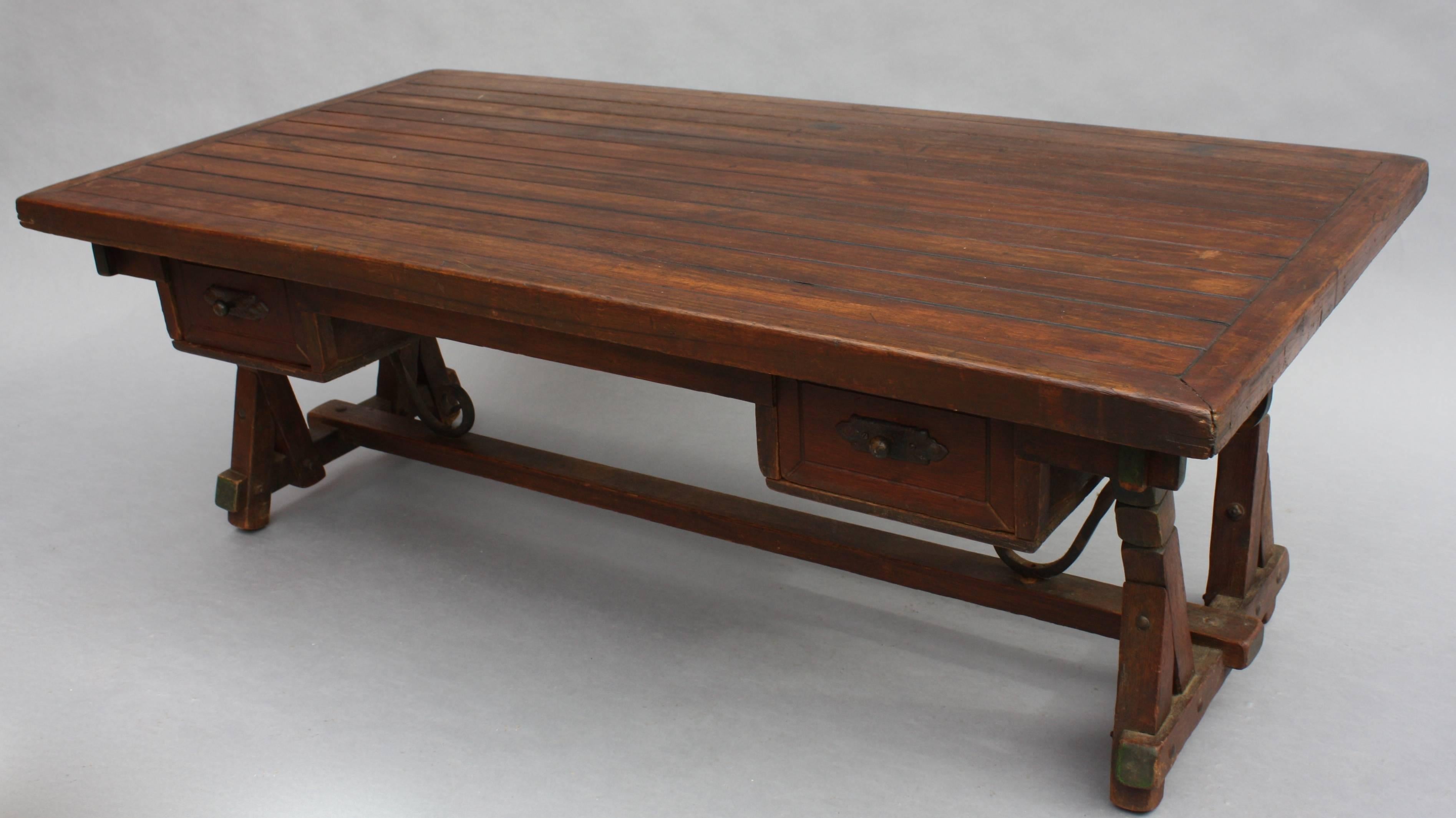 Wonderful Monterey period coffee table with original polychrome accents and two drawers for storage.
