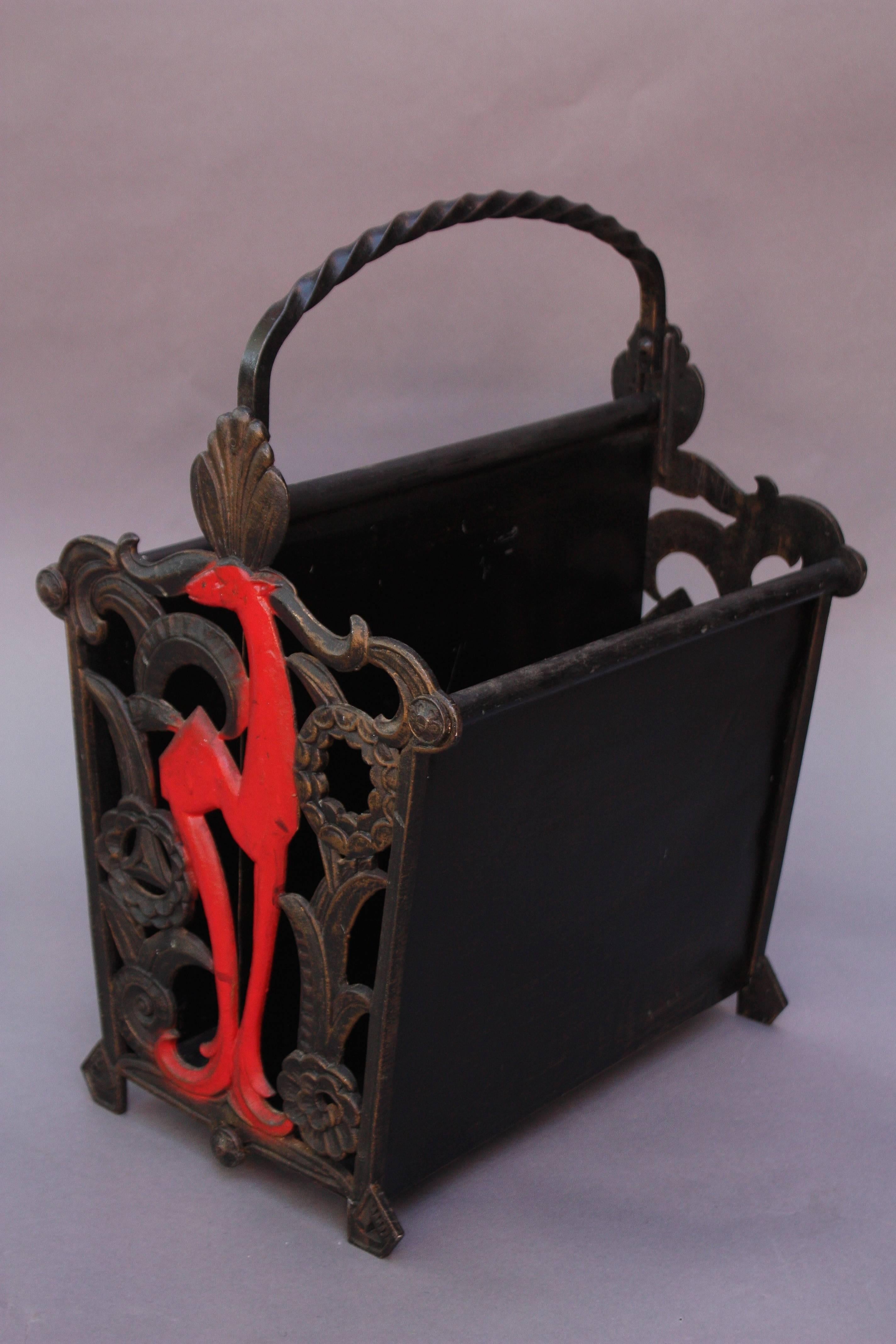 Striking 1920s cast iron magazine rack with original polychrome finish.