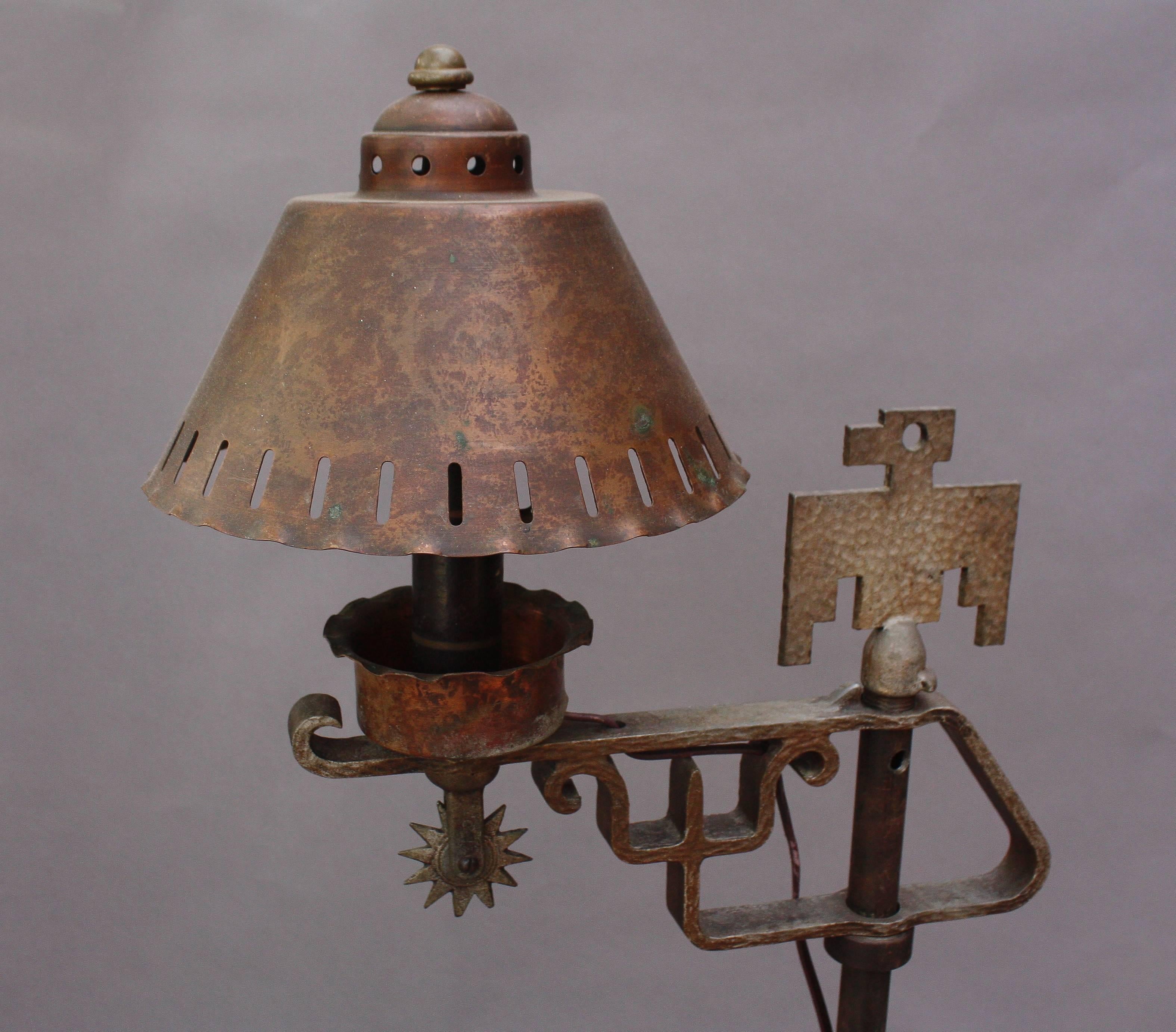 Hard to find 1930s floor lamp with thunderbird and horseshoe motif.