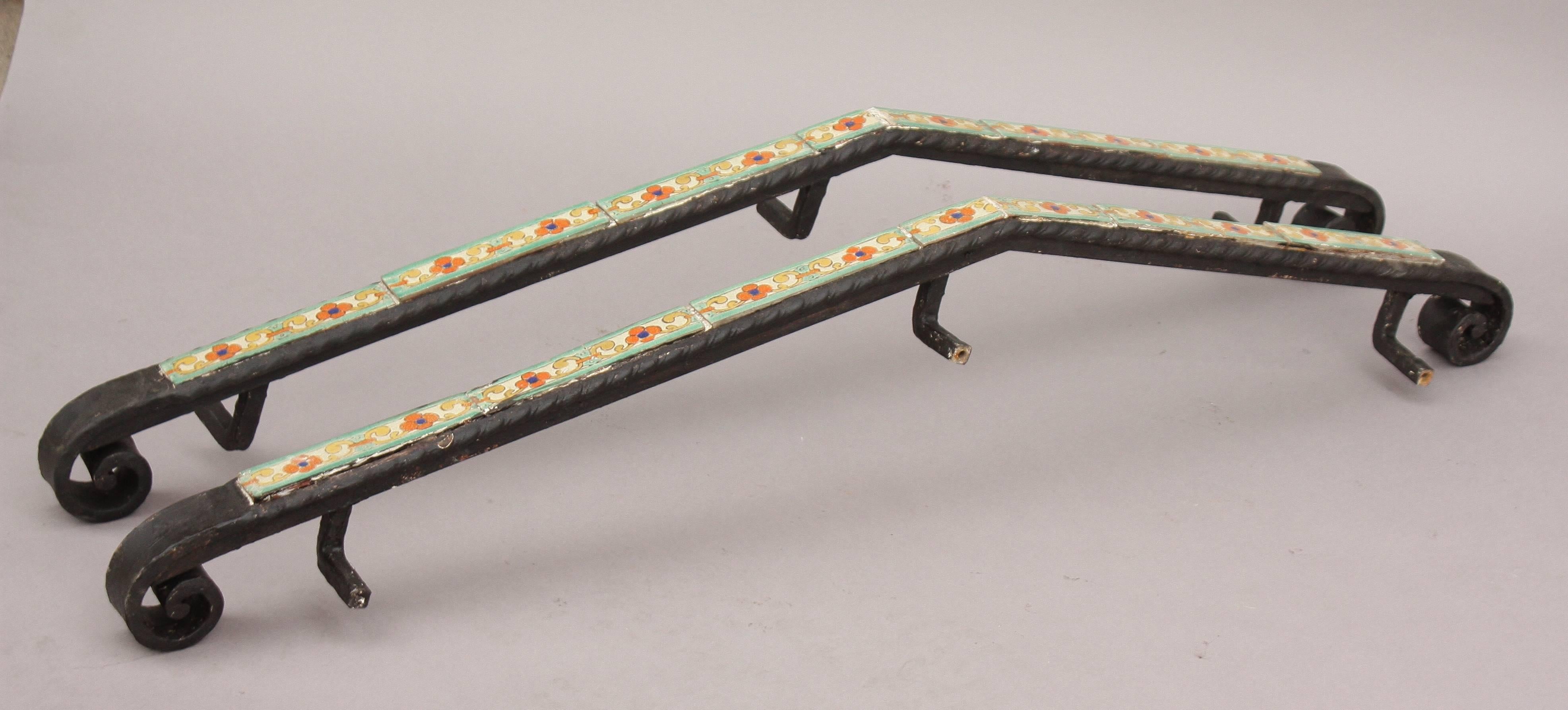 Wonderful pair of wrought iron hand rails with inset D&M tiles. A rare find.