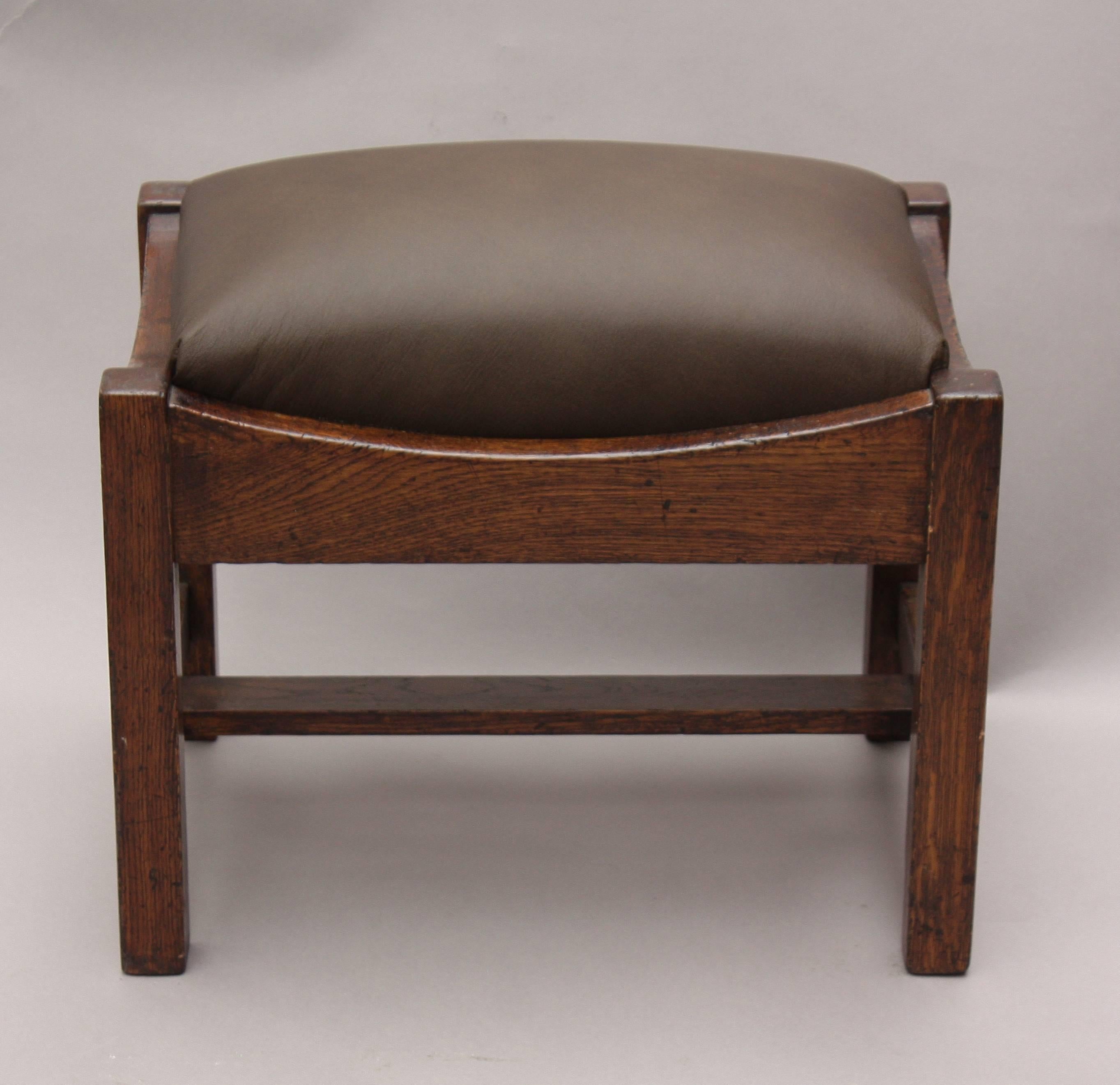 Craftsman period foot stool with new leather upholstery.
