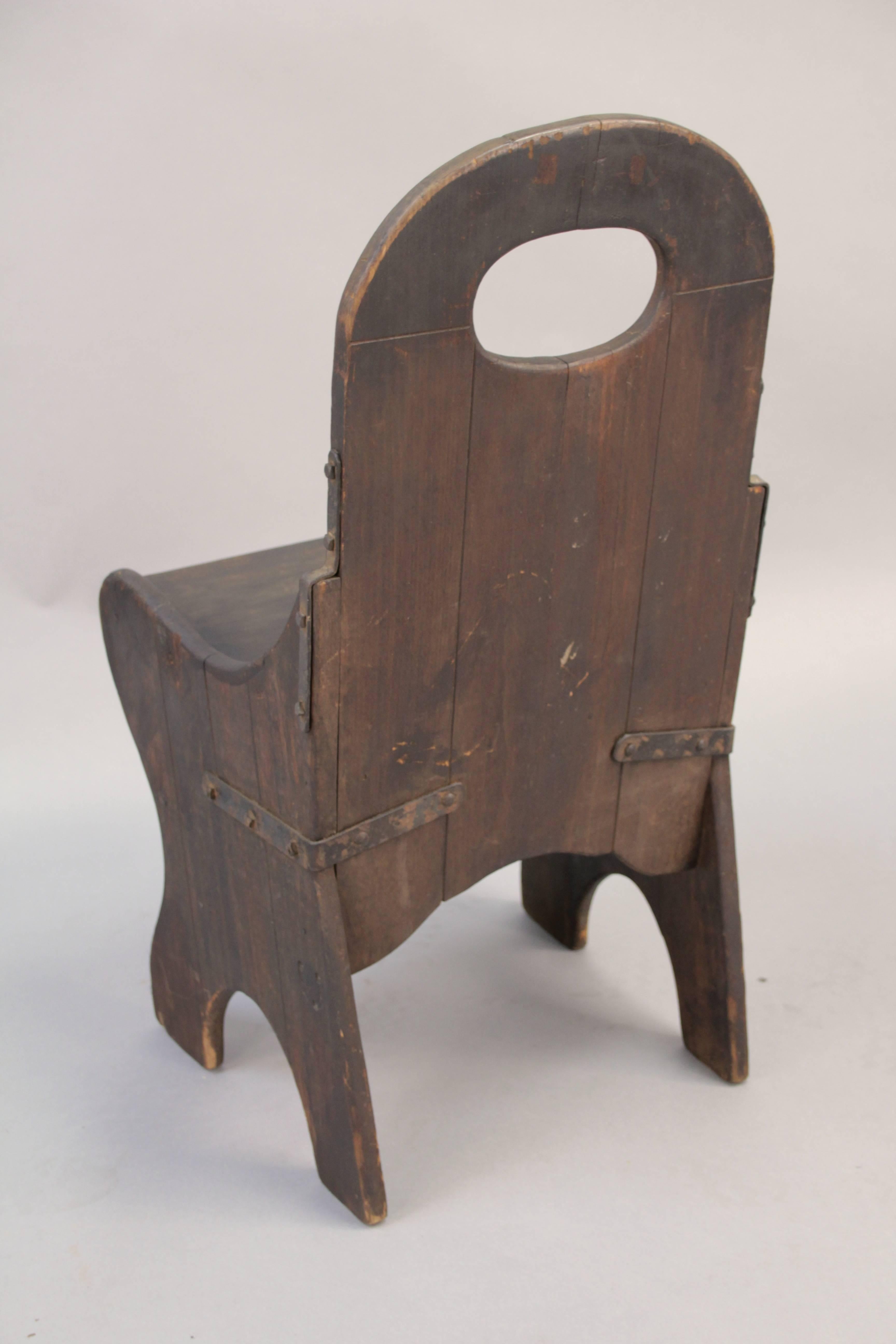 Great early Monks chair with original finish, circa 1930s. Signed.