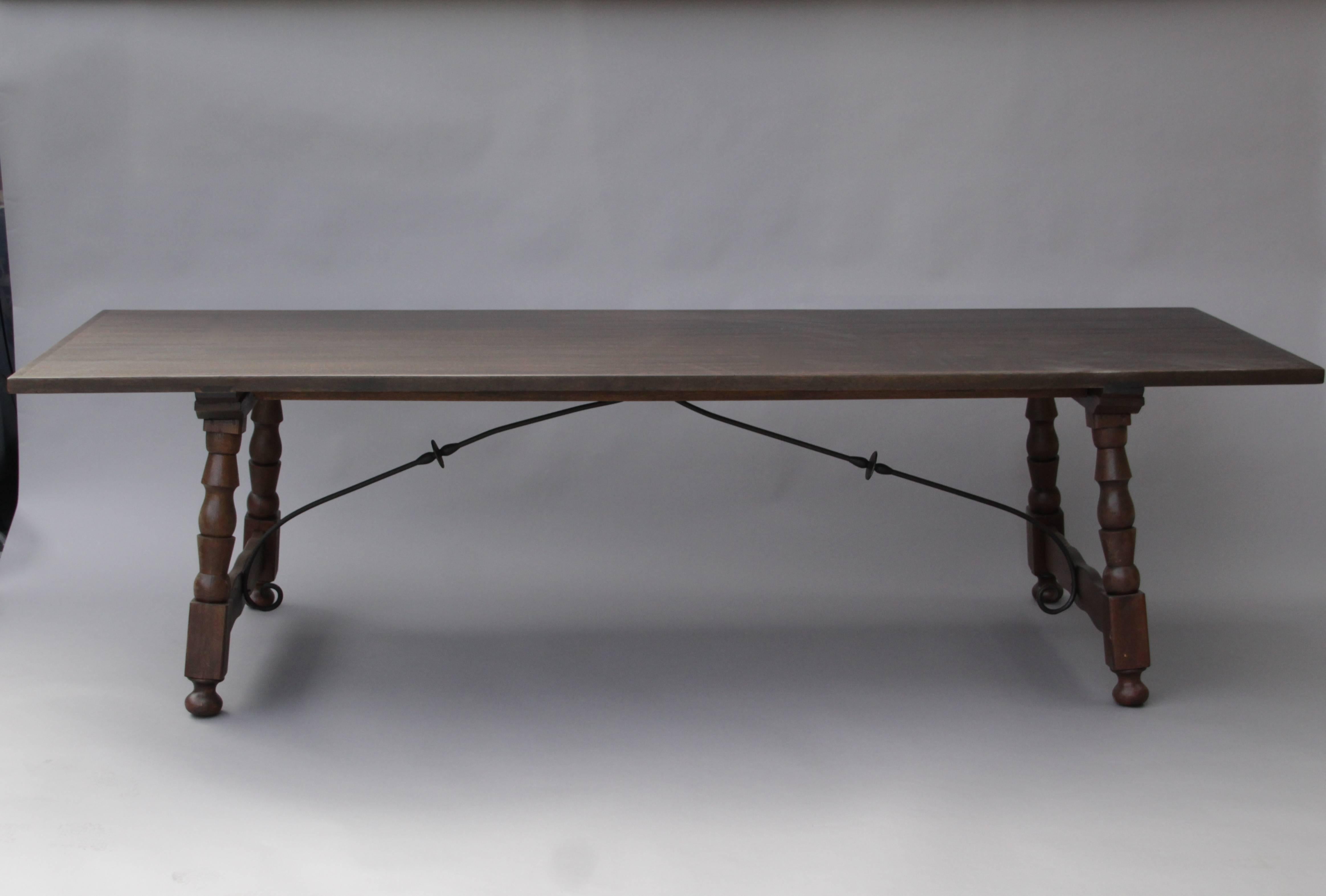 Attractive Spanish Revival table with iron trestle and splayed legs, circa 1920s.