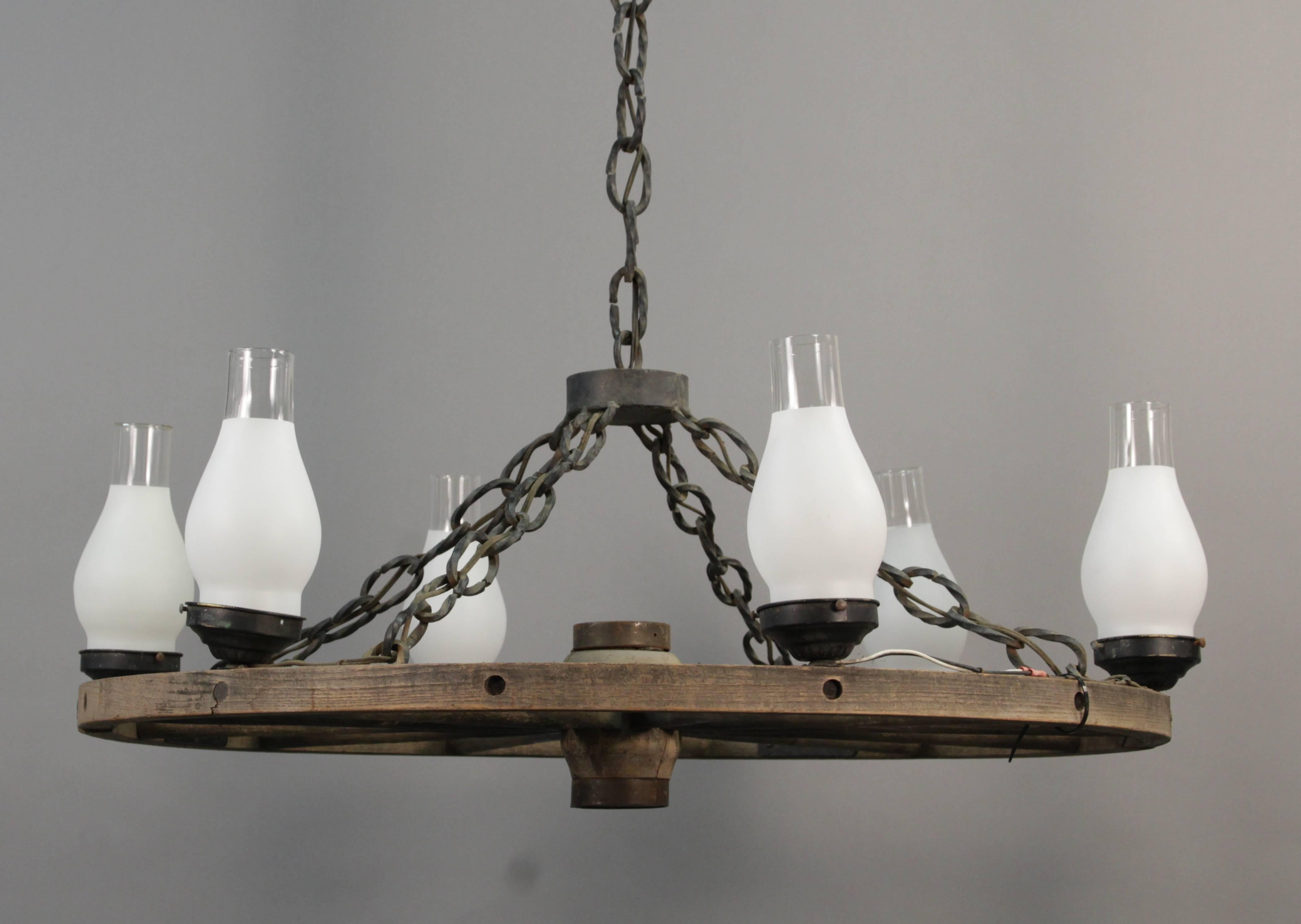 Sold and priced separately. Impressive wagon wheel chandelier with six lights.

Measures: 17