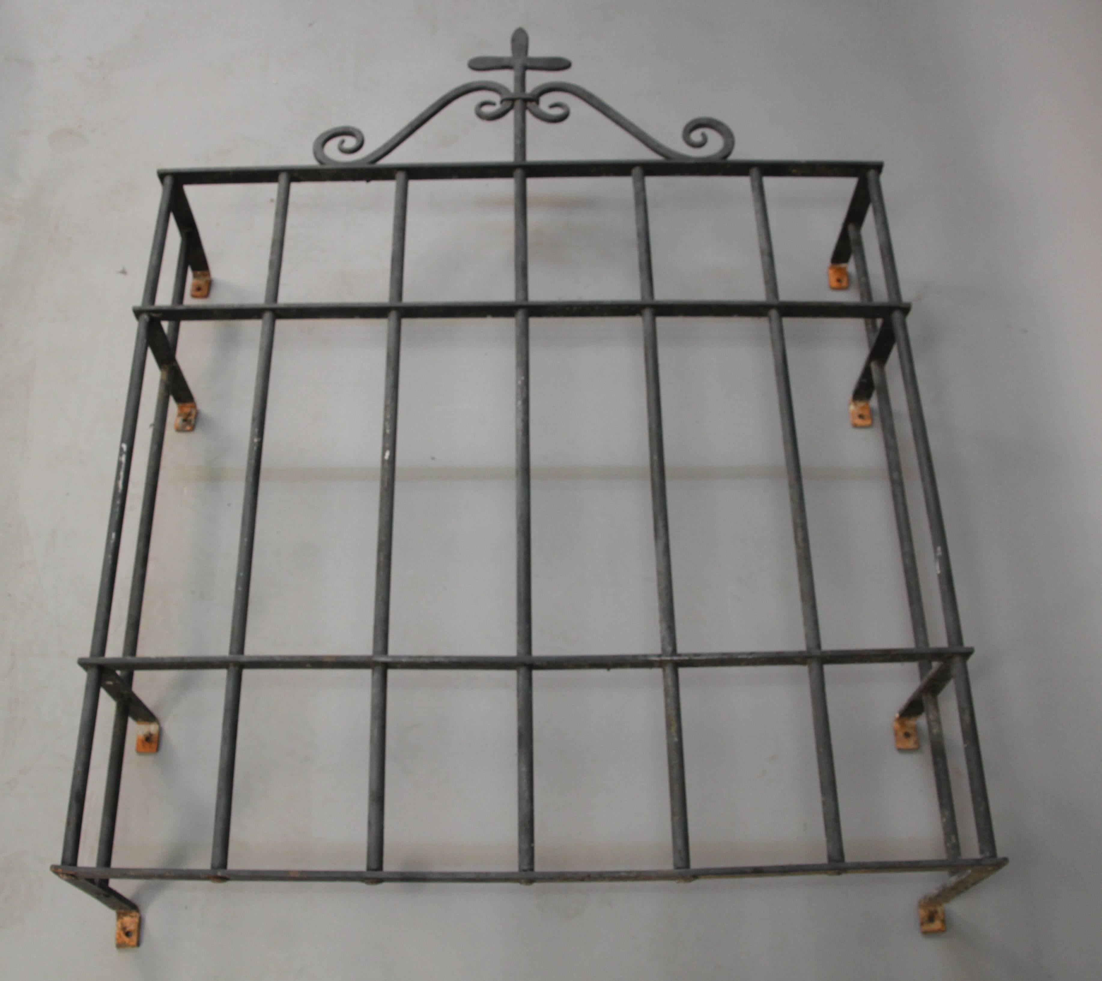 Beautiful and finely crafted 1920s wrought iron window grill. We have a matching, larger piece available. 

The overall height is 54 3/4
