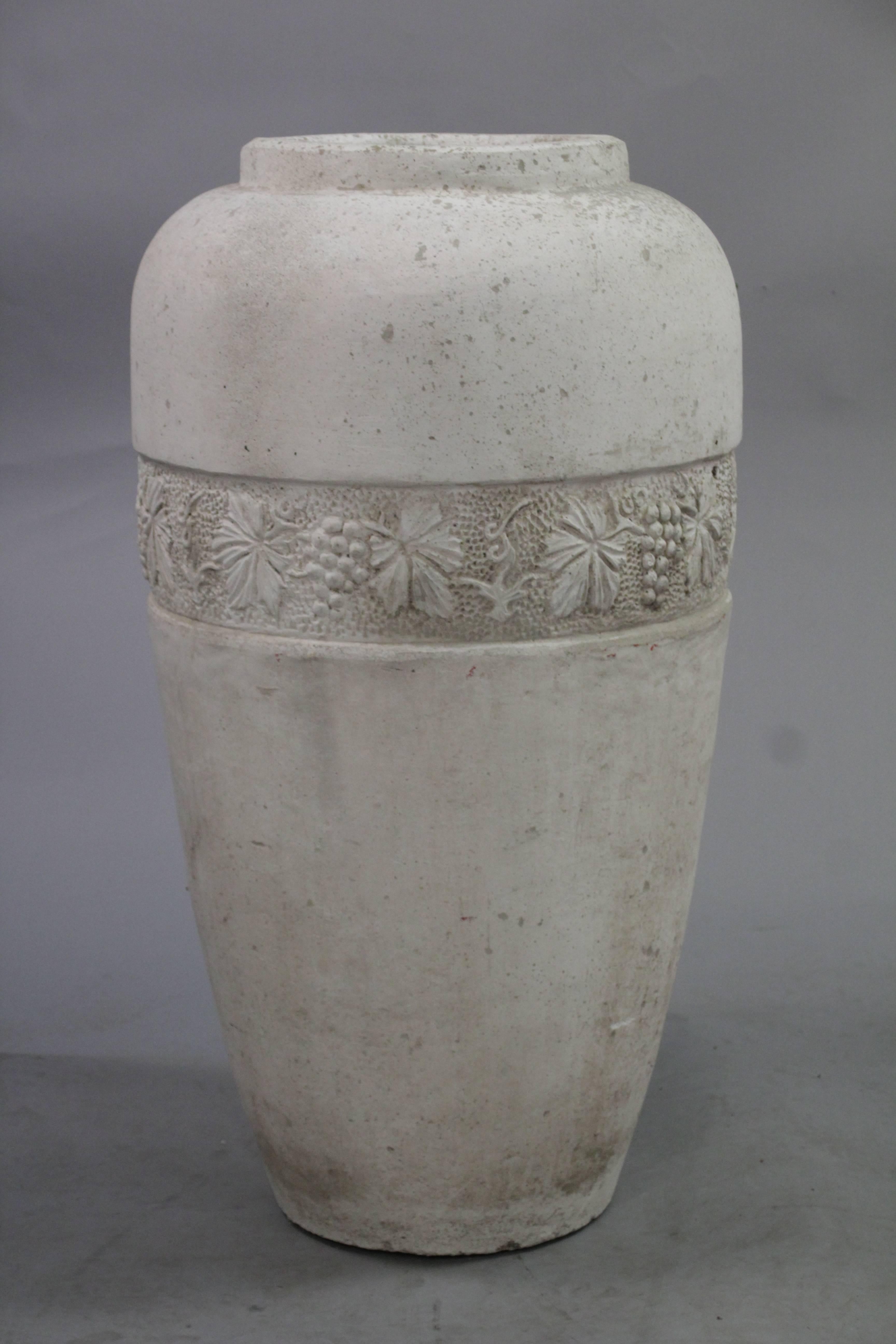 1920s concrete vase wrapped in a detailed grapevine pattern.
     