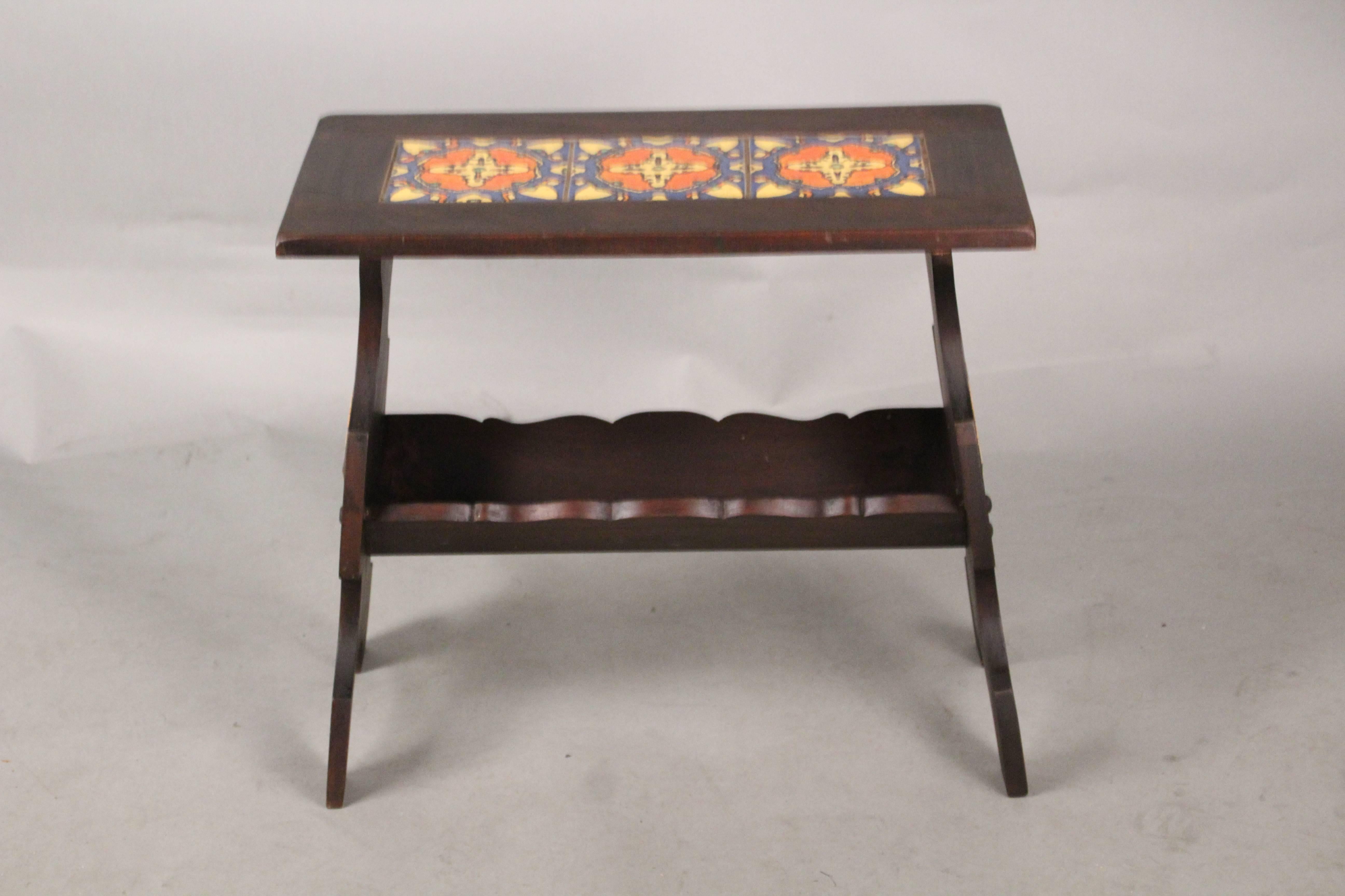 Walnut 1930s tile table or magazine stand with magazine rack. Tile by Malibu tile company, circa 1930s.