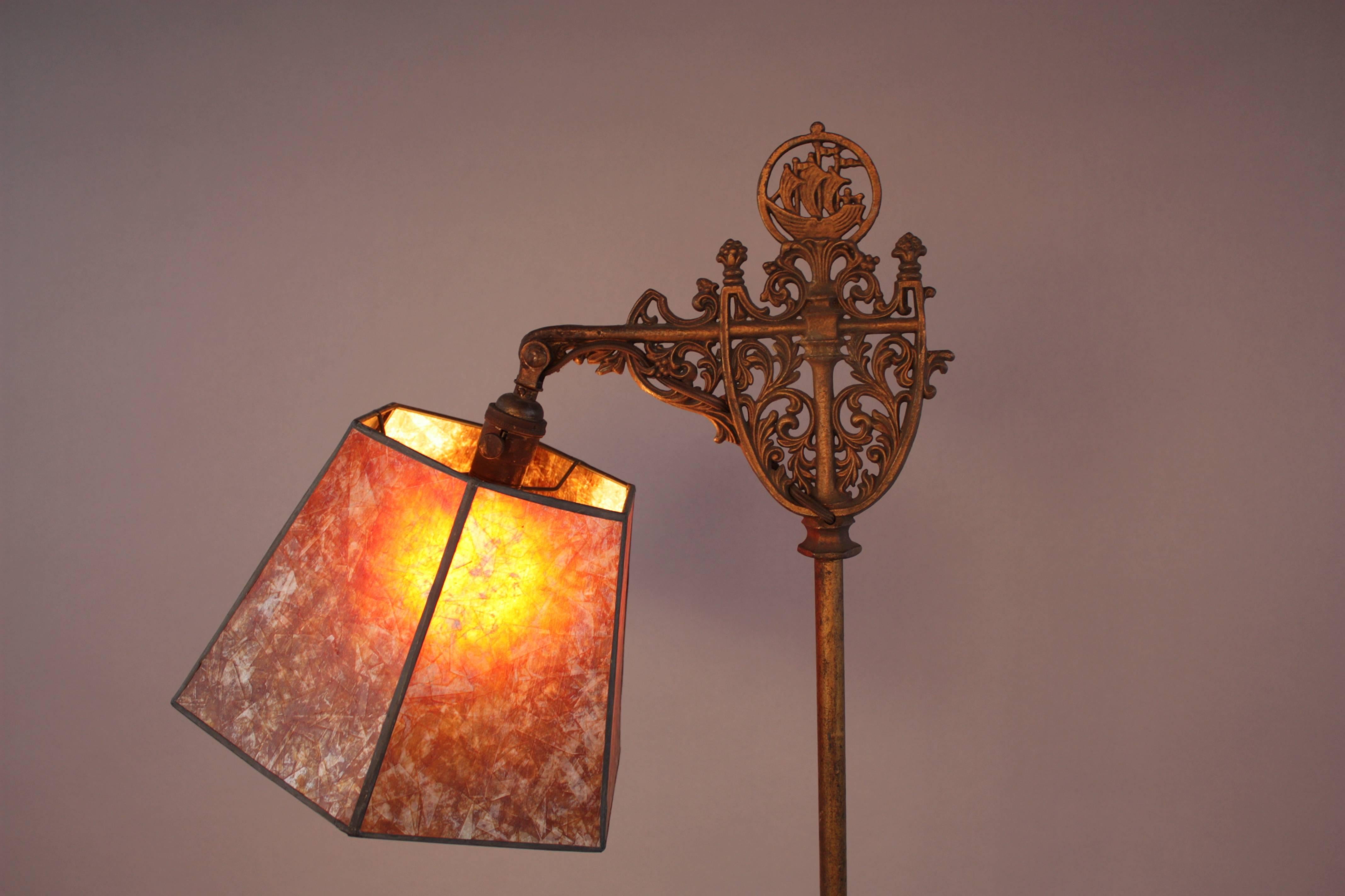 Circa 1920's bridge lamp with classic Spanish Revival ship motif.  Contemporary mica shade.
