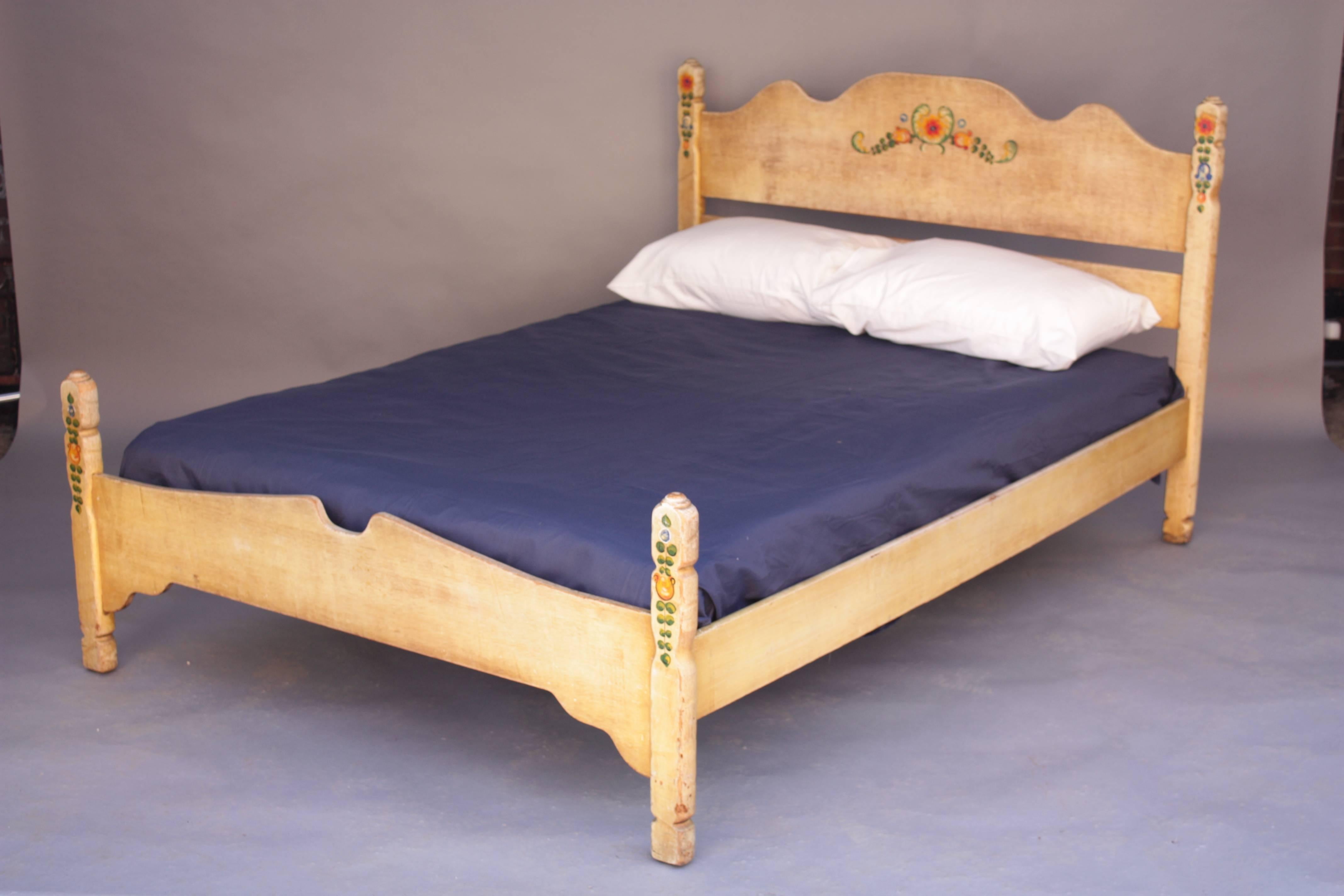 Circa 1930's double bed manufactured by Barker Bros signed Monterey. Hand applied decorations.