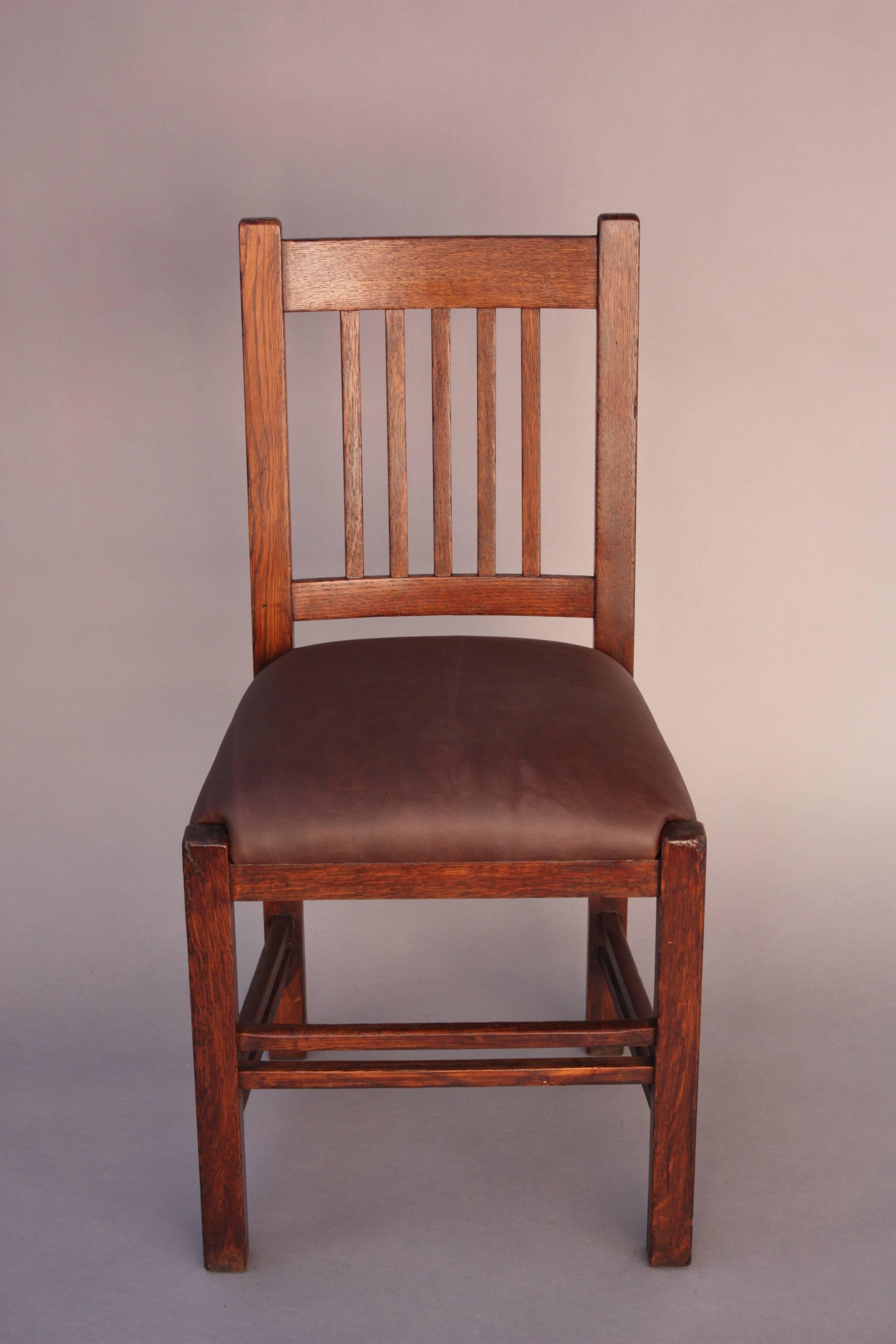 Circa 1910 side chair with Prairie Style spindles. New leather upholstery.