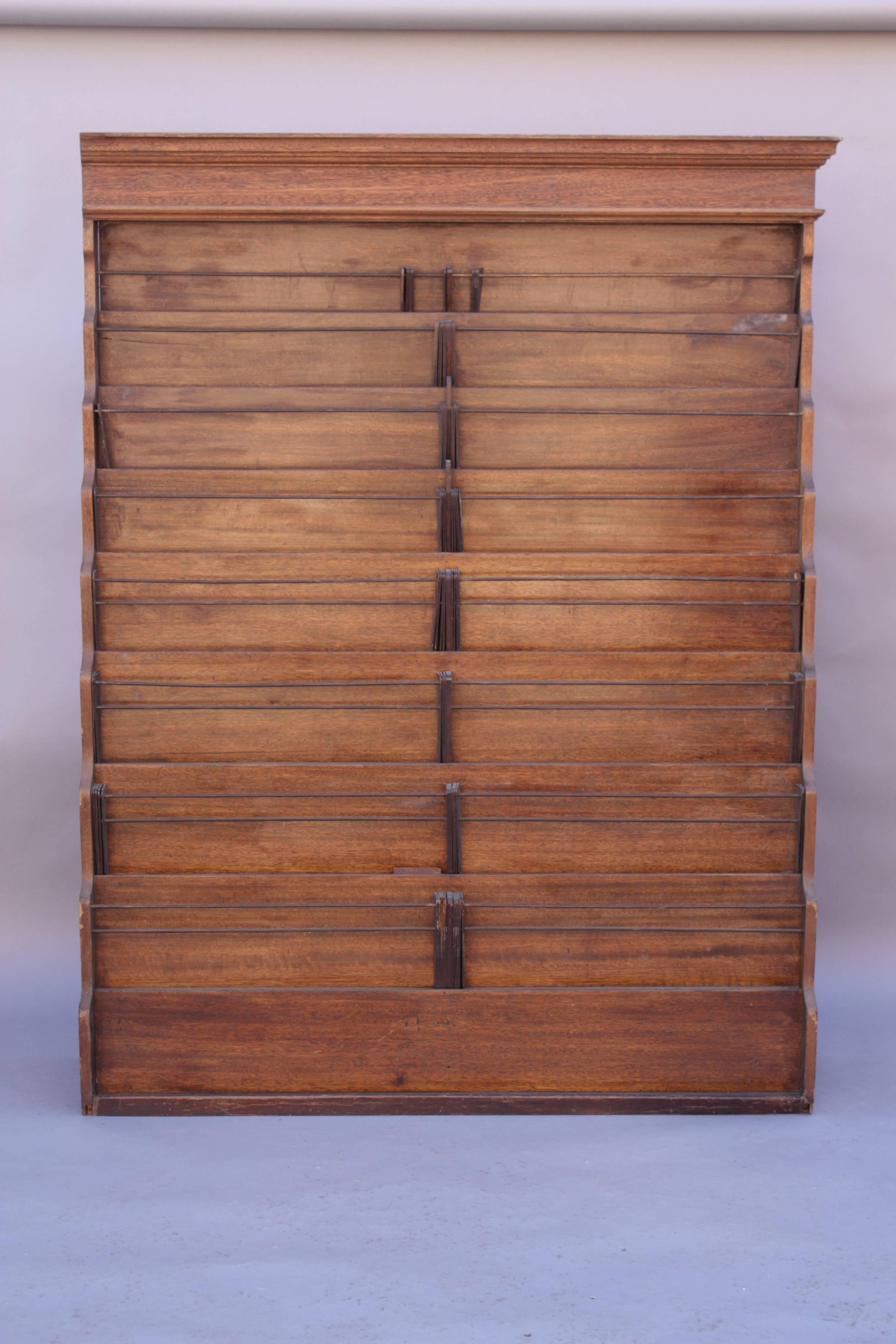 Early 1900s news stand magazine rack with original wooden dividers. 