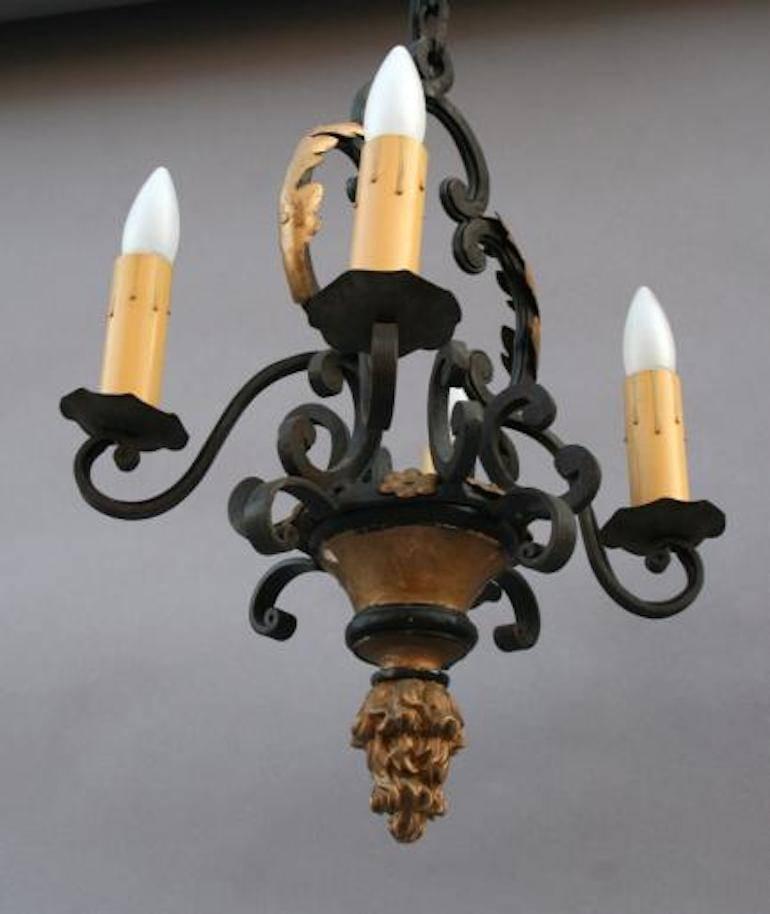 European iron 4-light chandelier with original finish circa 1920's. An elegant chandelier for the Mediterranean home.