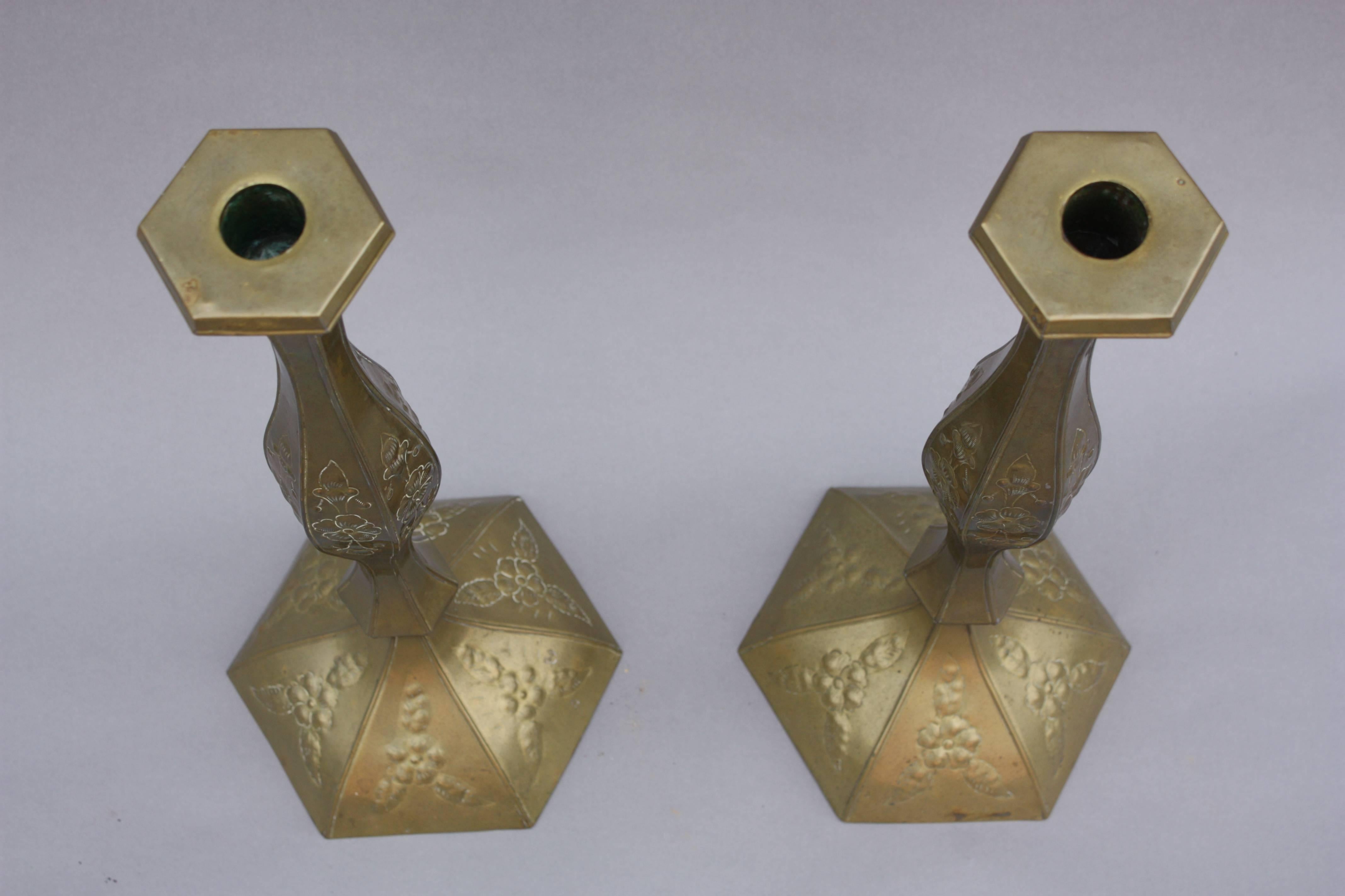 Large scale pair of brass Mexican candlesticks.