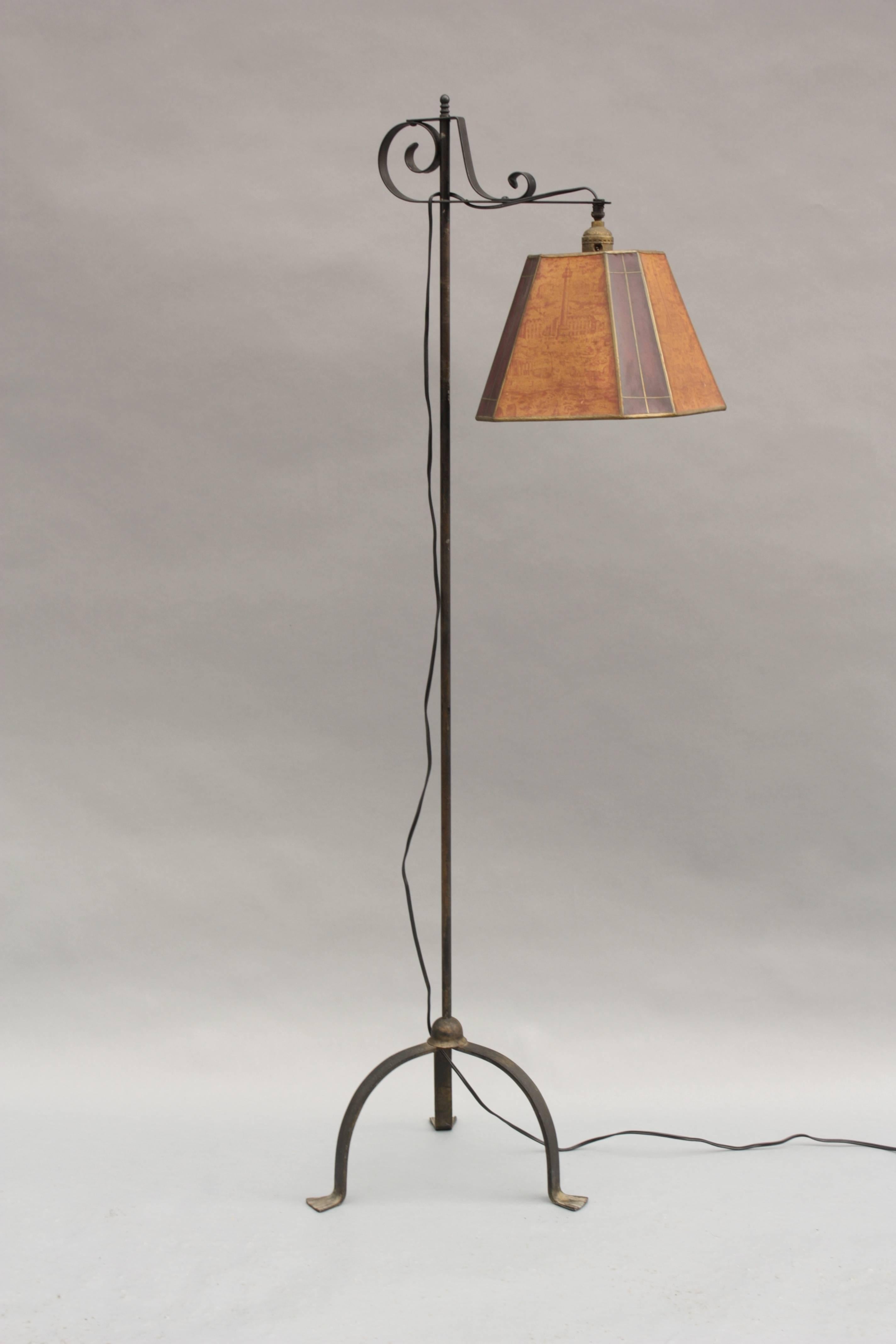 Iron floor lamp with adjustable paper shade, circa 1930s. Measures: 55.63