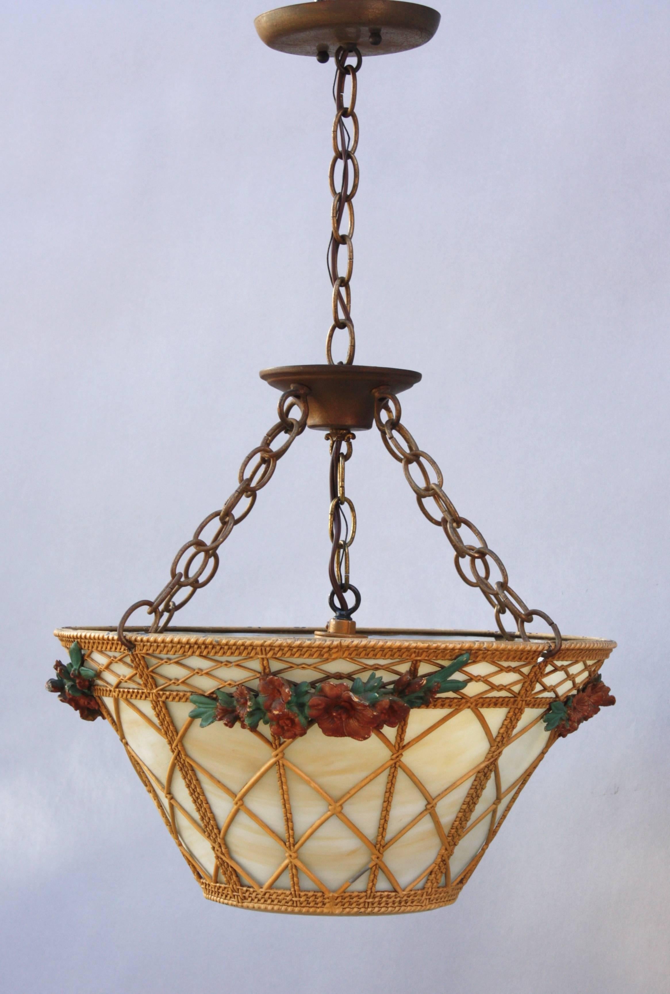 Unusual 1930s pendant designed as a flower basket. Features caramel colored milk glass.