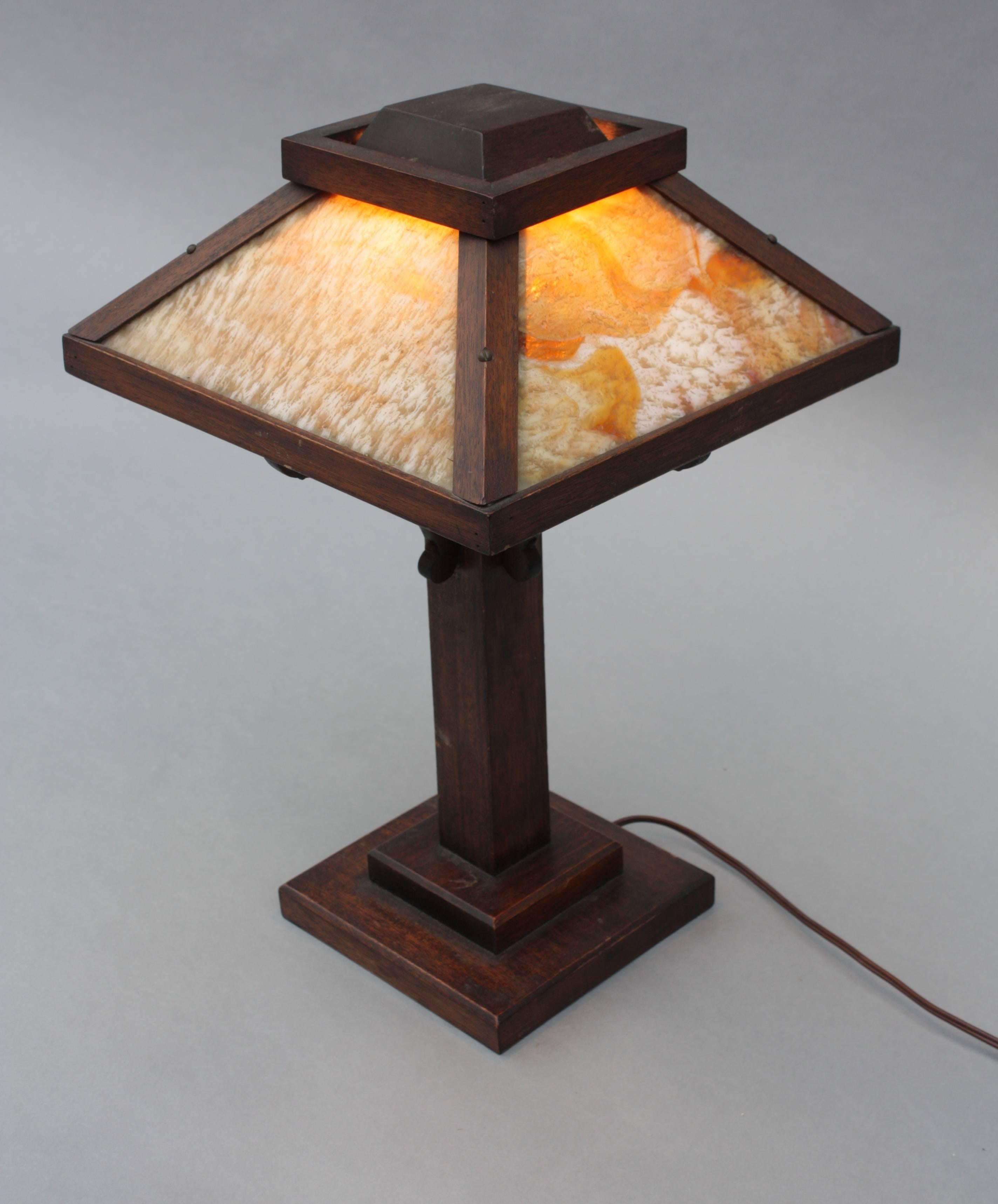 Table lamp with caramel slag glass and oak base, circa 1910.