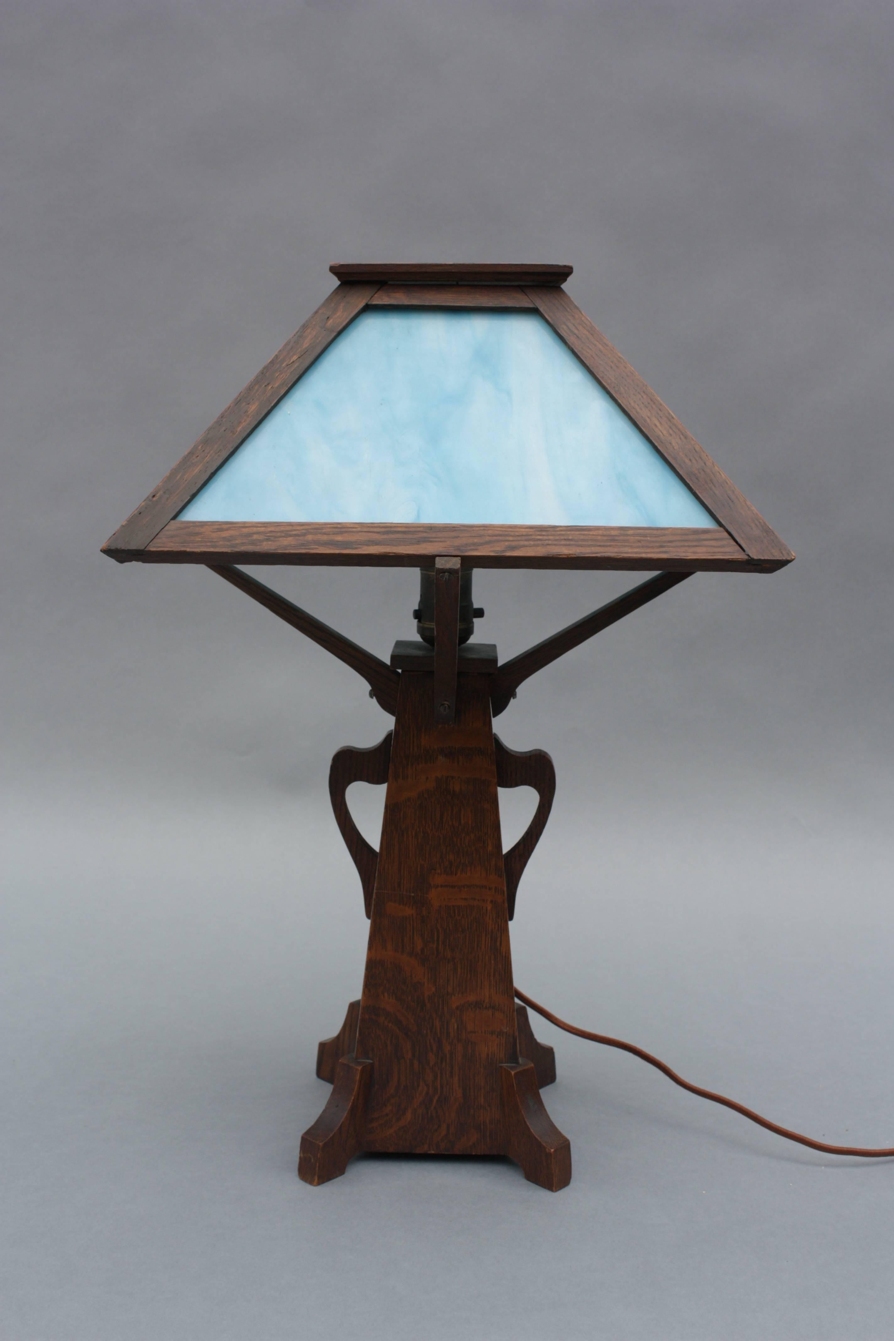 Graceful Arts & Crafts / Mission table lamp with blue slag glass.