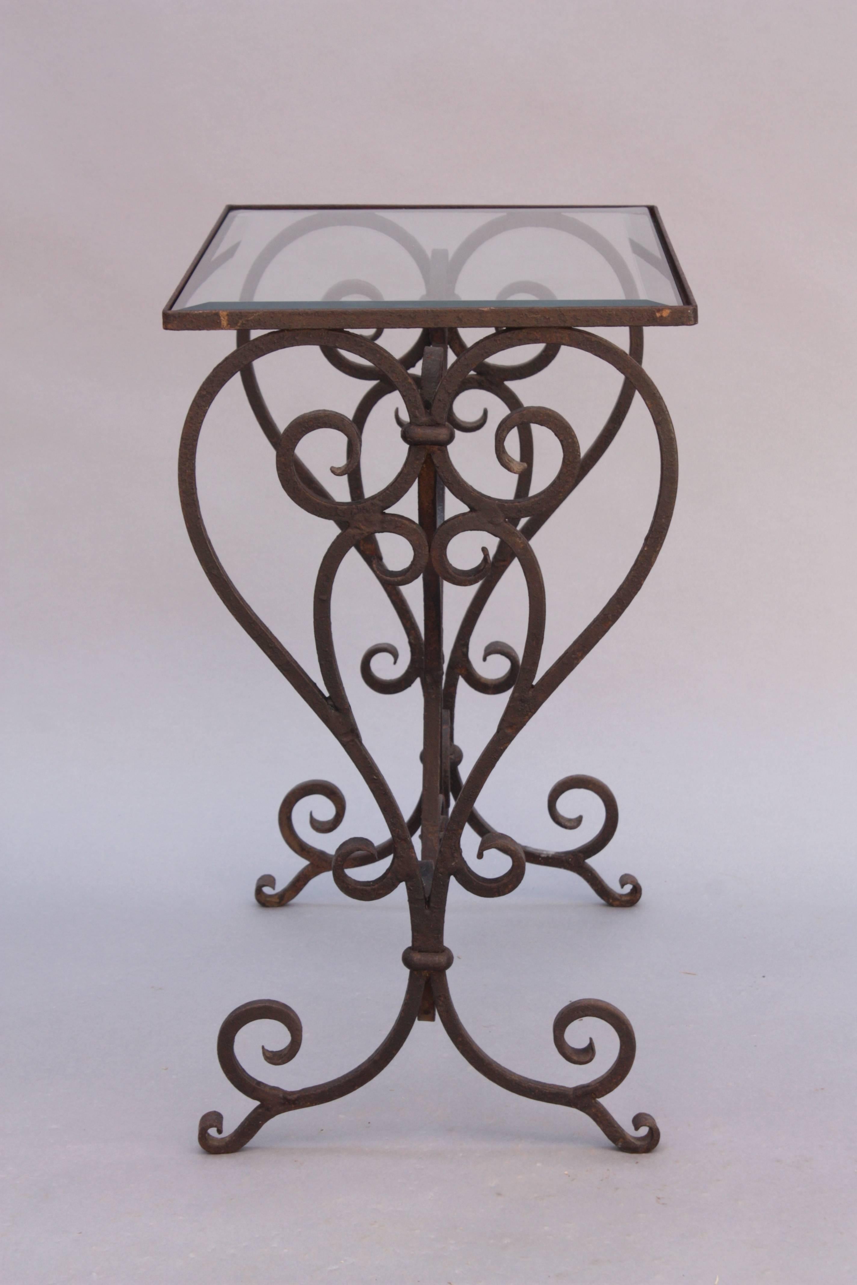 Spanish Revival side table with wonderful iron construction and glass top, circa 1920s.