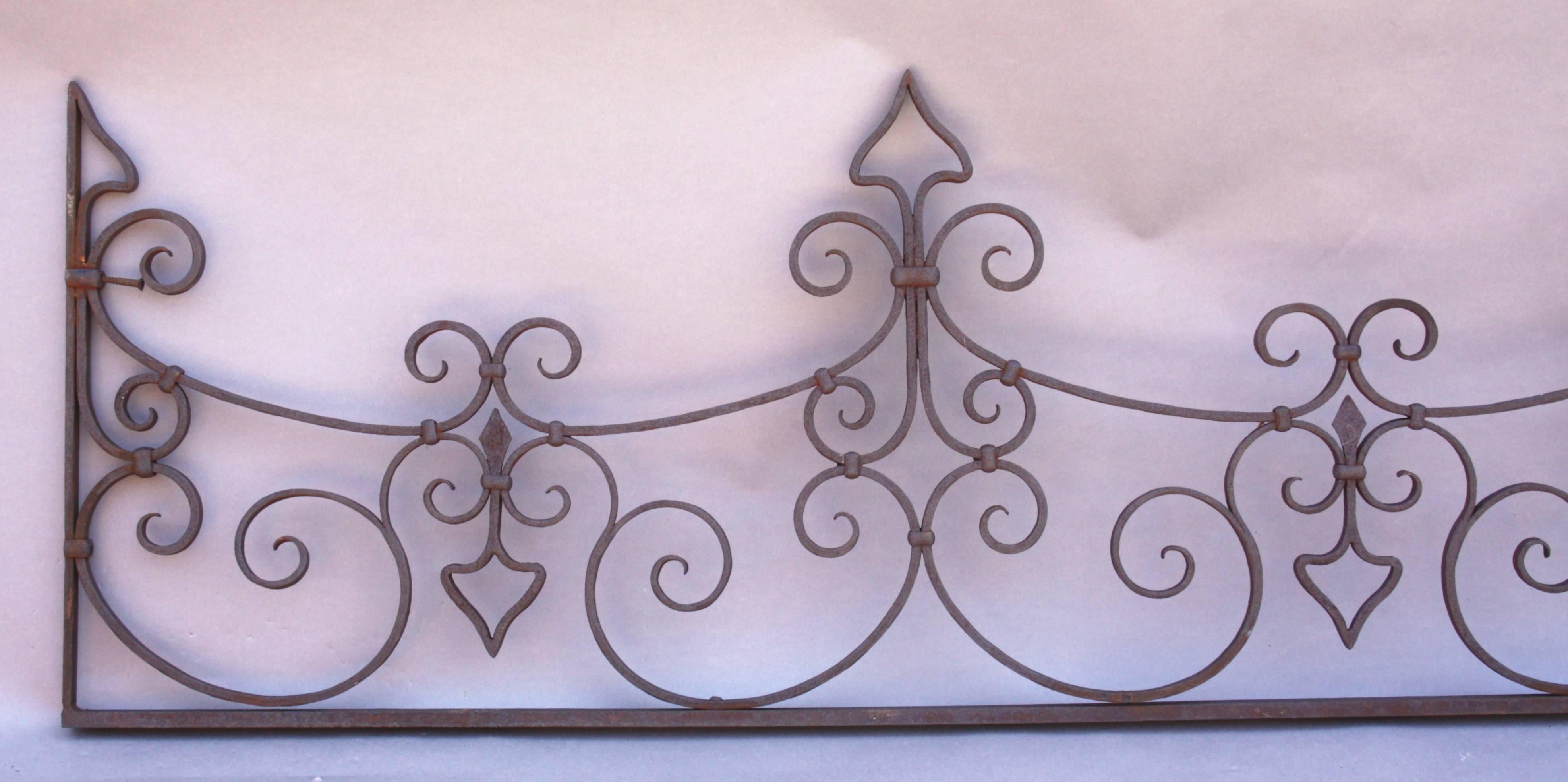 Nicely crafted 1920s wrought iron work with strapped construction.