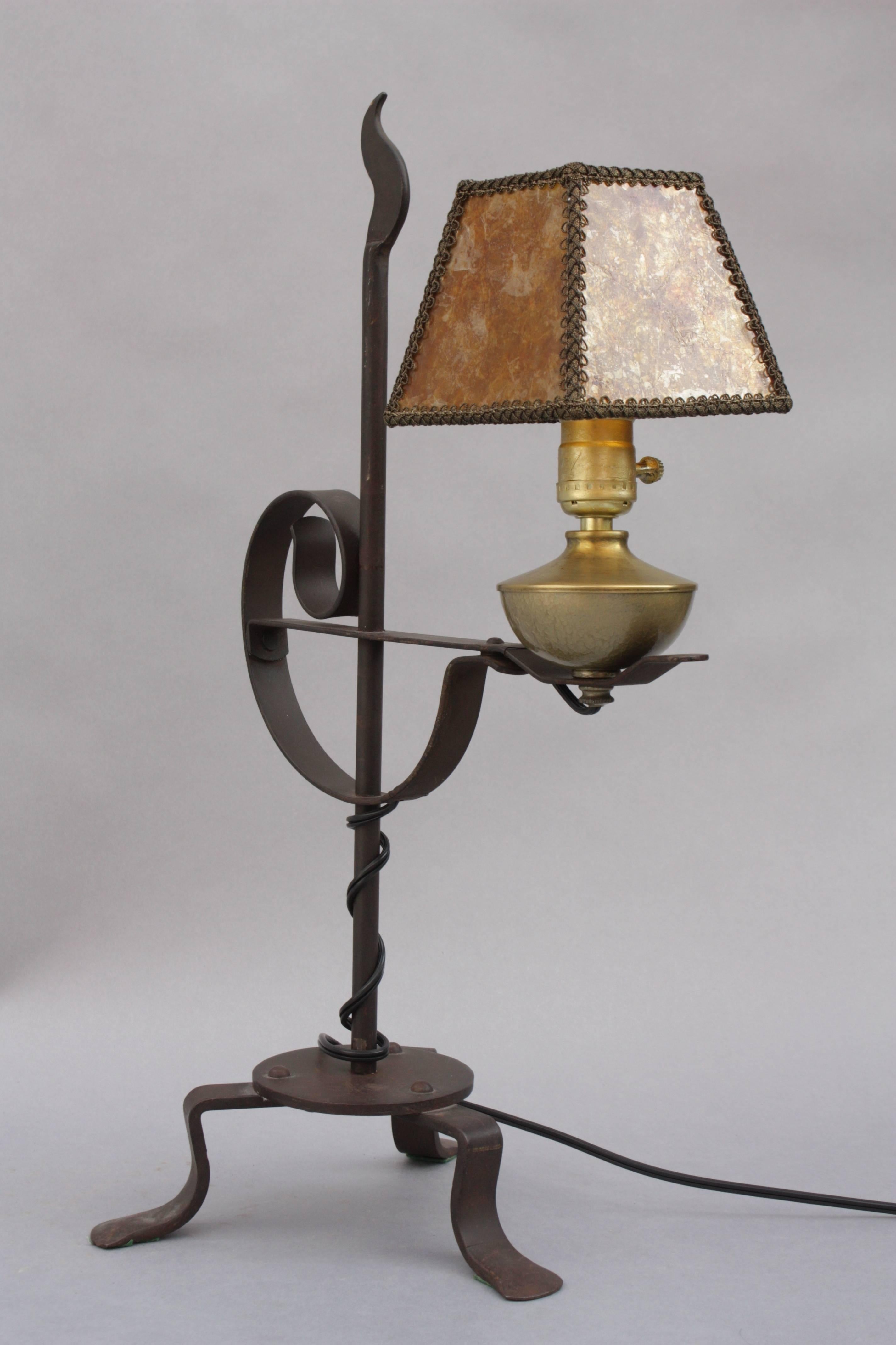 Adjustable height wrought iron table lamp.