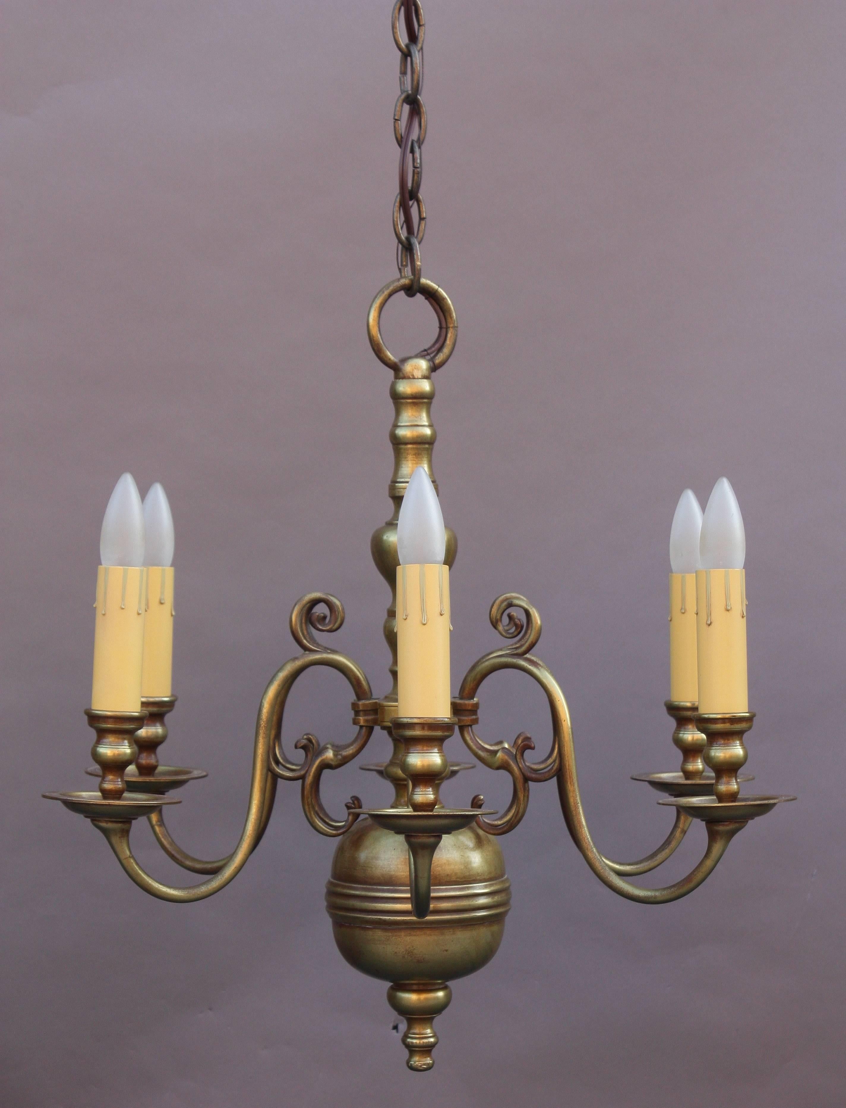 Elegant 1920s brass chandelier with beautiful casting. 23