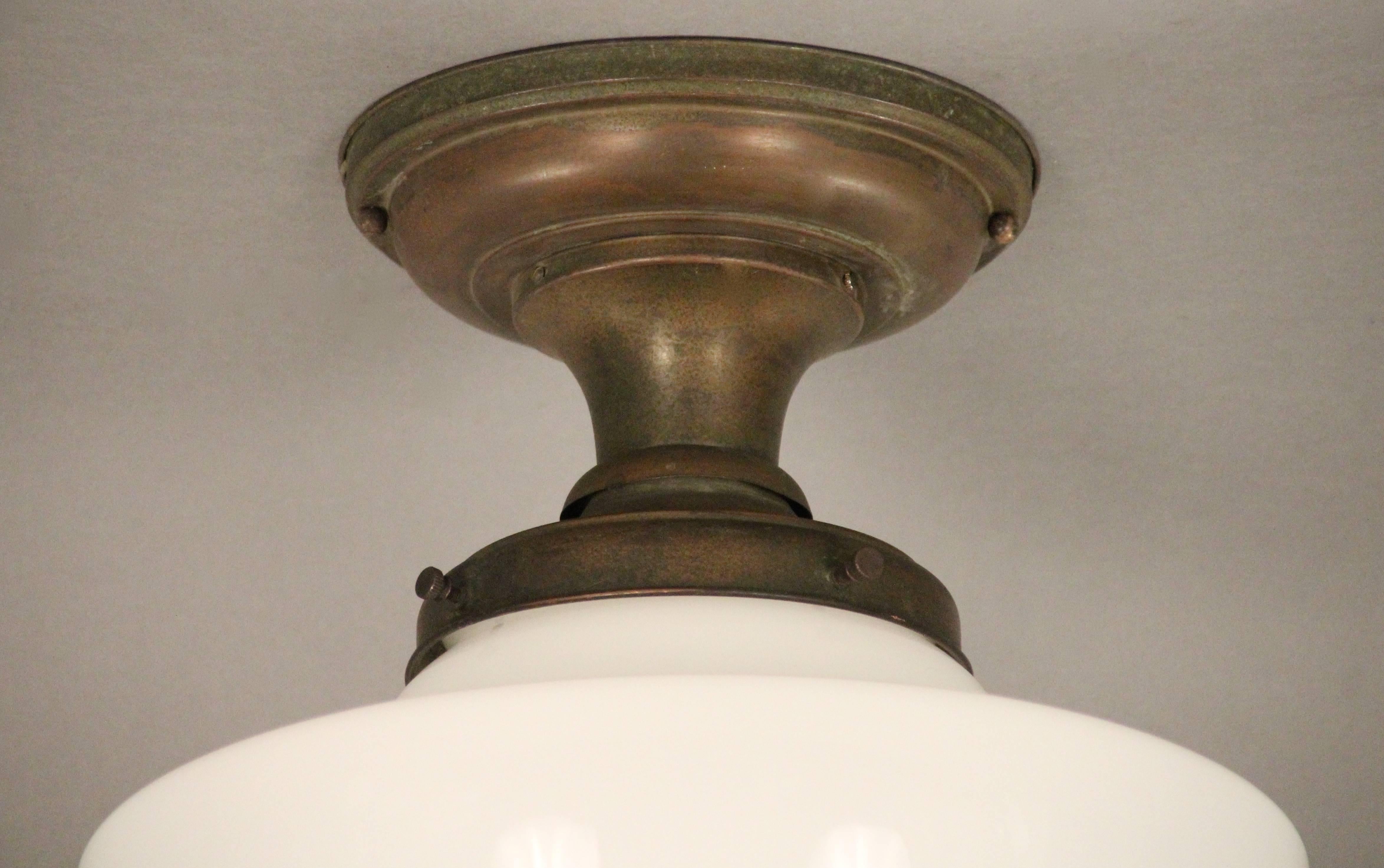 Ceiling mount with glass globe, circa 1930s.