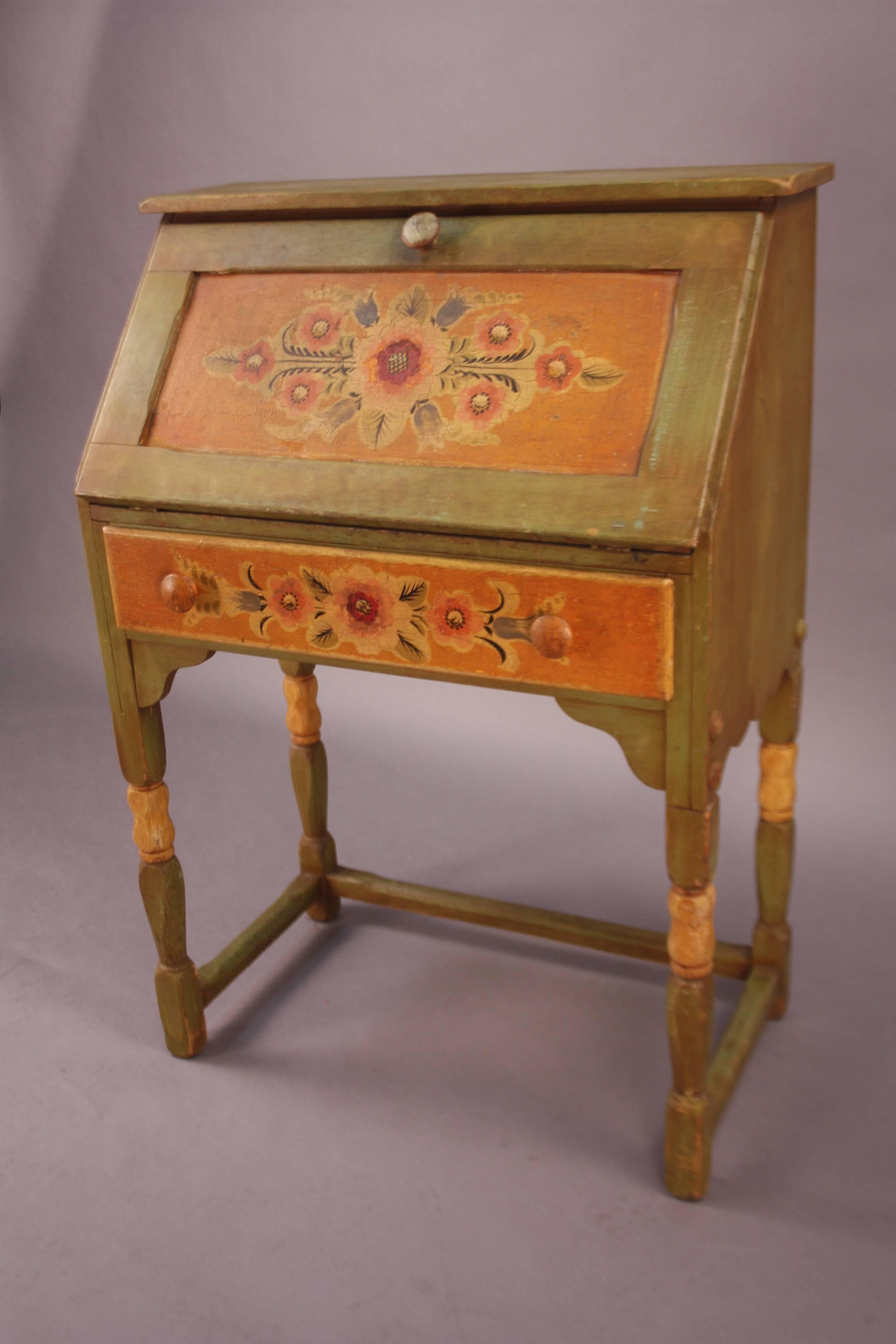 All original green and hand-painted Monterey desk with folding front panel and one drawer. Open the desk is 30