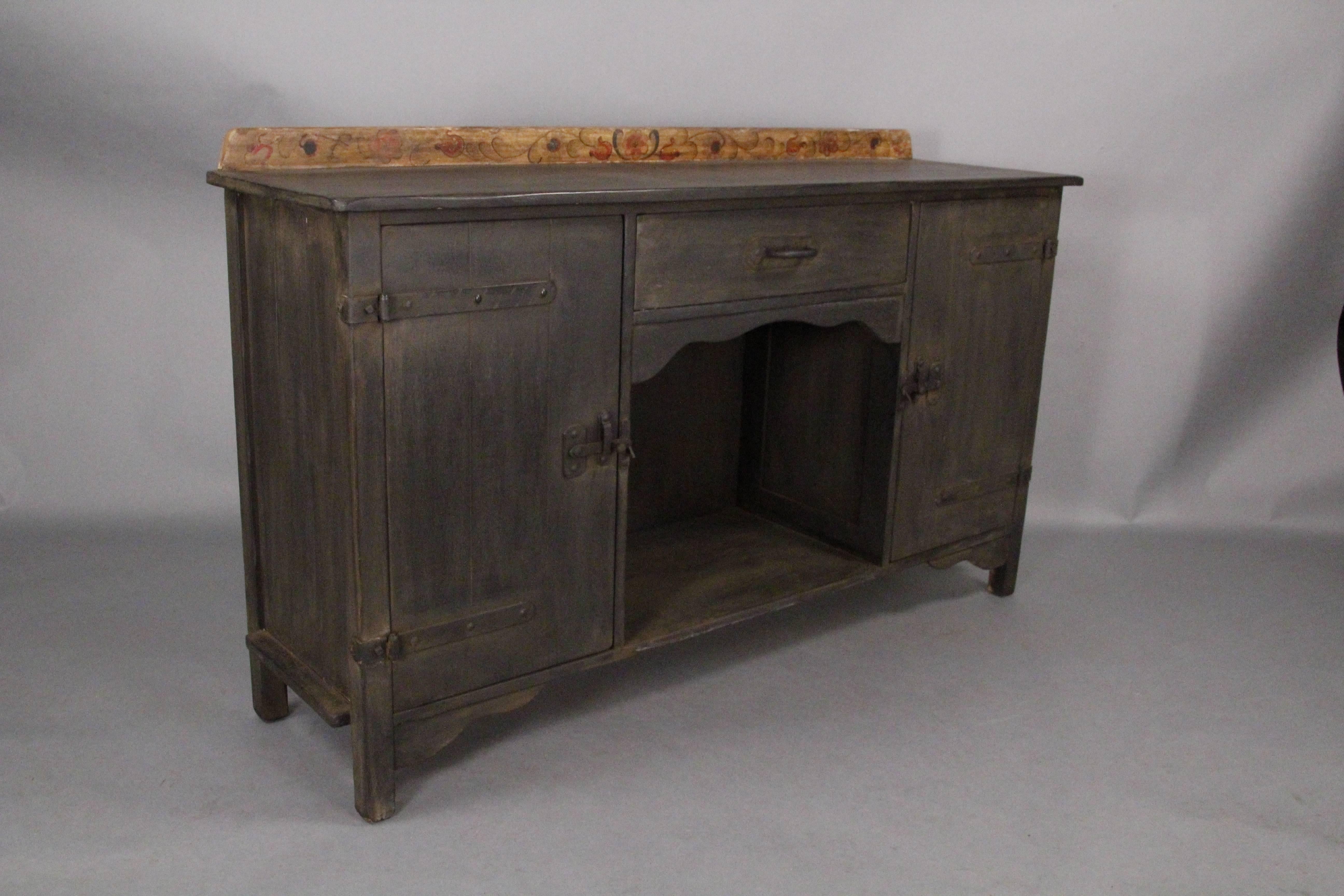 Sideboard with great iron hardware and hand-painted back rail, circa 1930s. Restored finish. Signed.