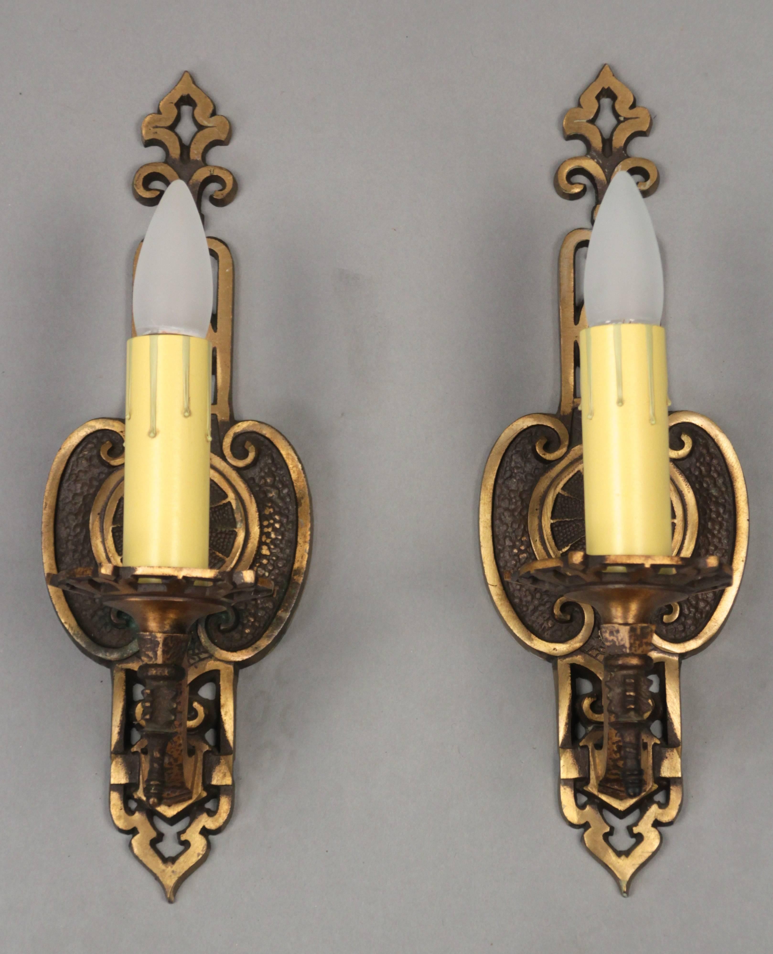 Pair of finely cast sconces in a warm golden tone, circa 1920s.