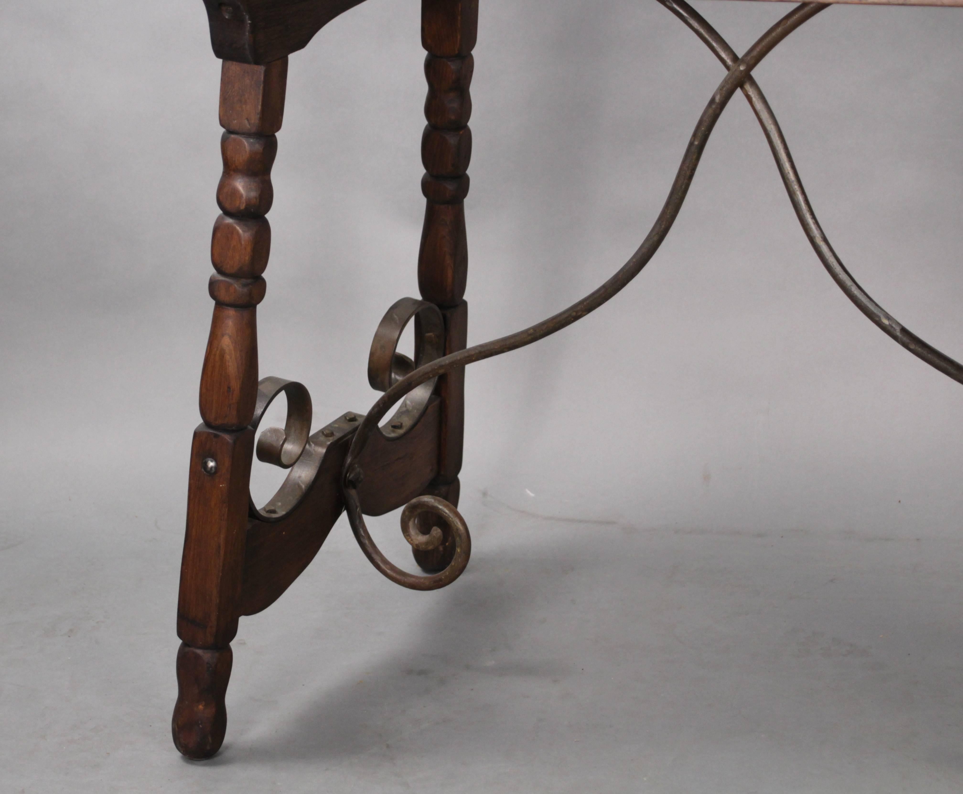 Hard to find console table, circa 1930s. Great iron strapping.