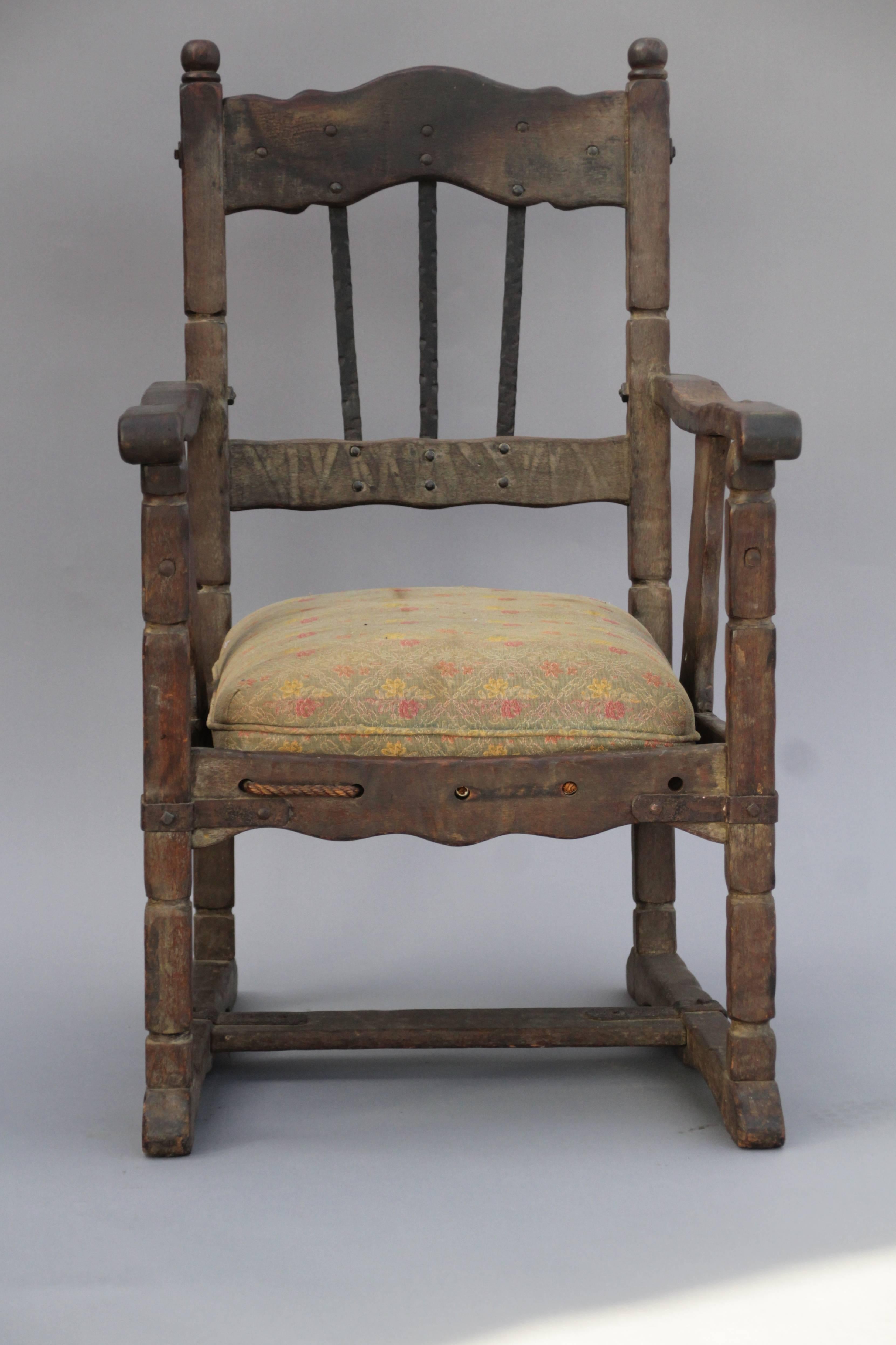 Very rare monterey armchair with original finish. Great wrought iron detailing and original rope. Signed.