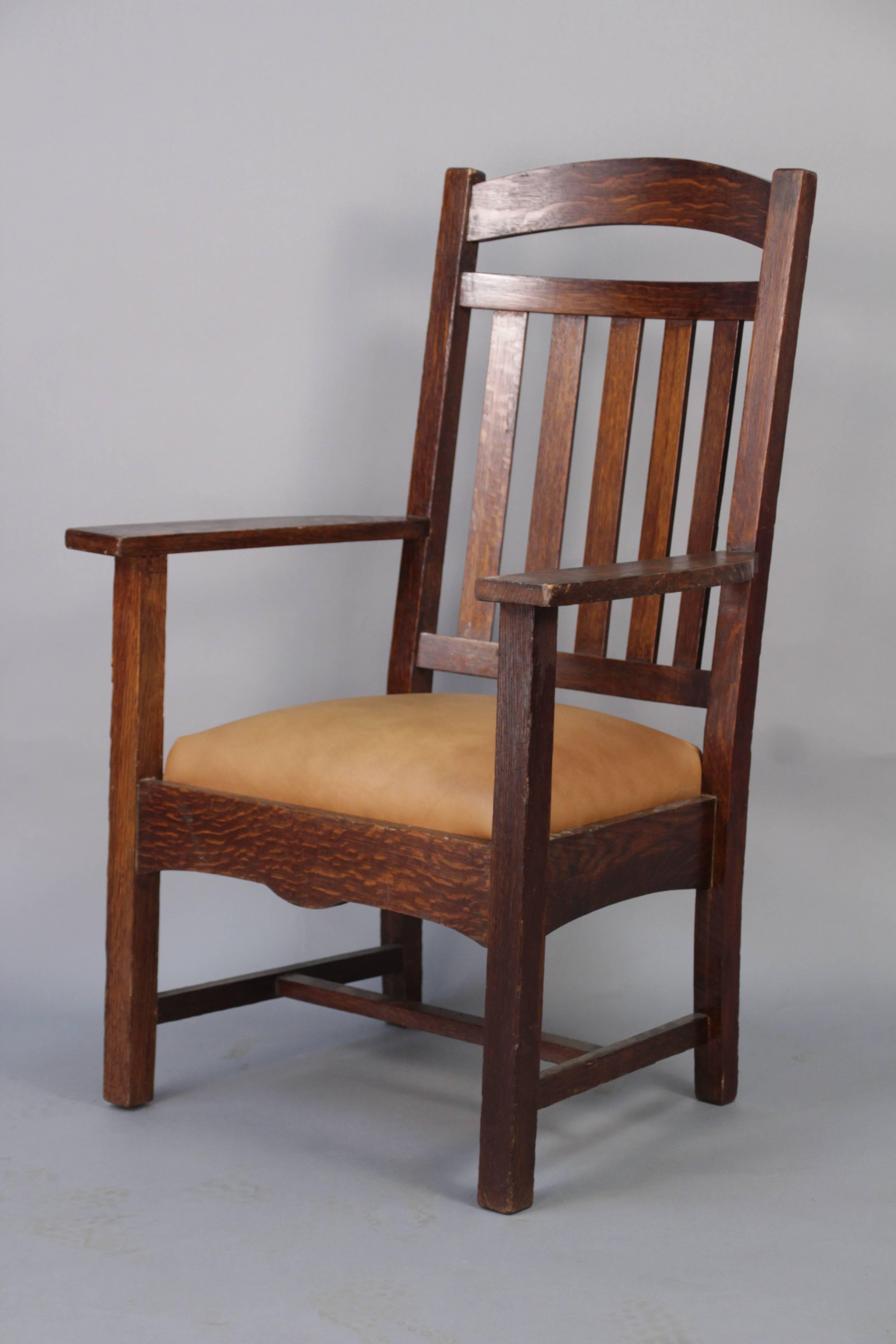 Handsome Arts & Crafts quarter sawn armchair newly upholstered in leather. Stately design.