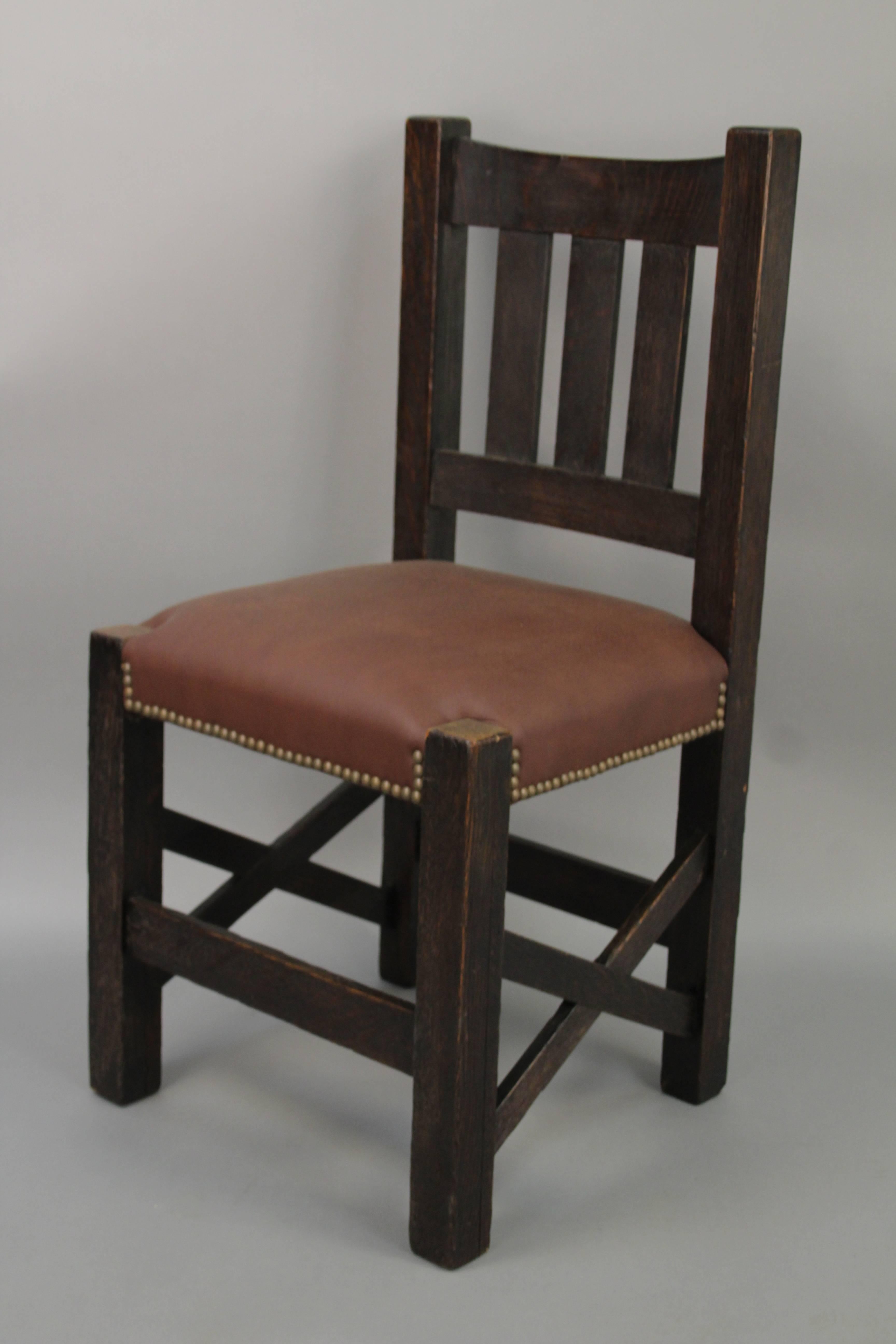 Arts & Crafts side chair with cross stretchers and leather seat.