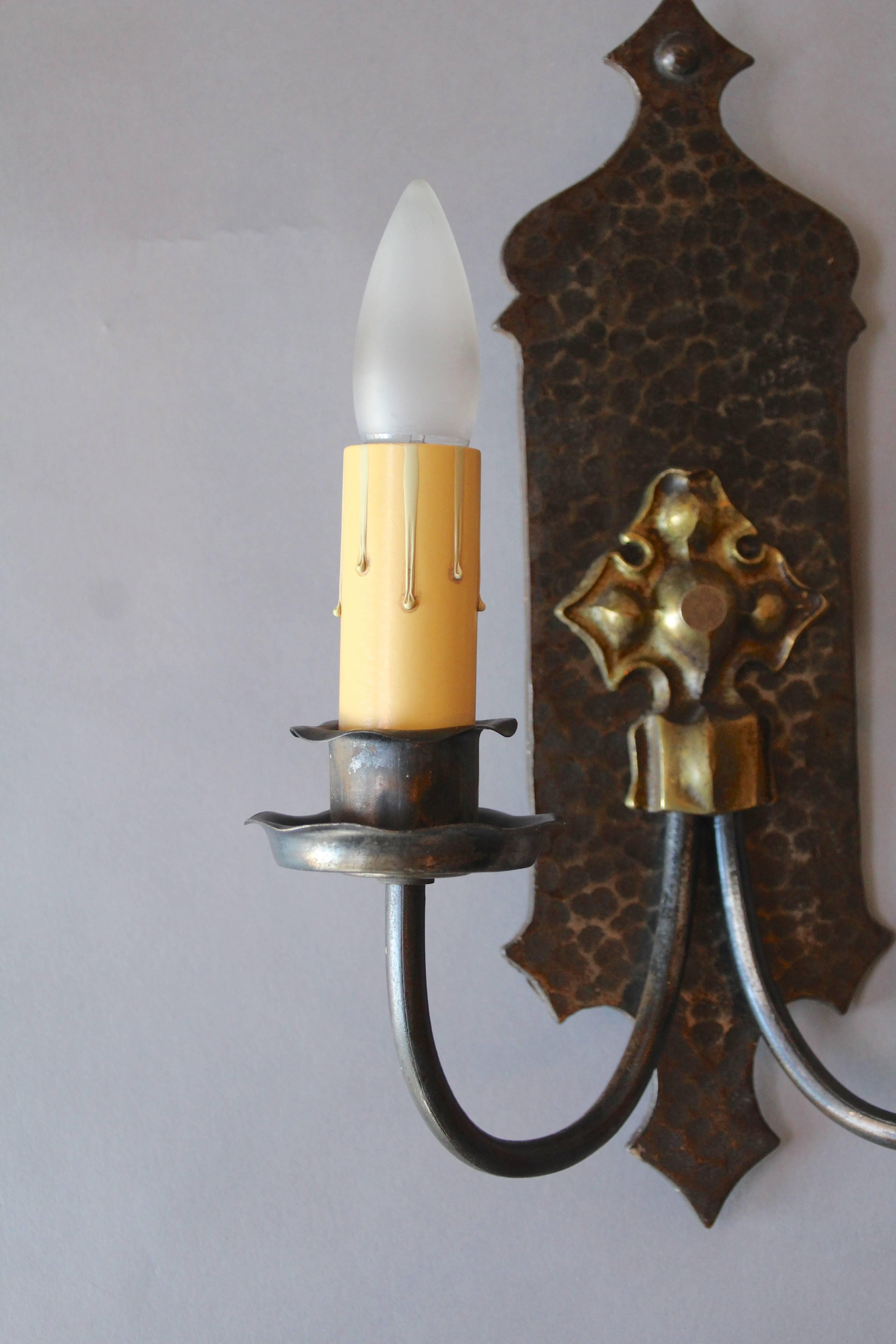 Priced and sold individually. Two left. Double sconce with hammered texture, circa 1920s. Would fit in Spanish Revival, tudor or story book home.