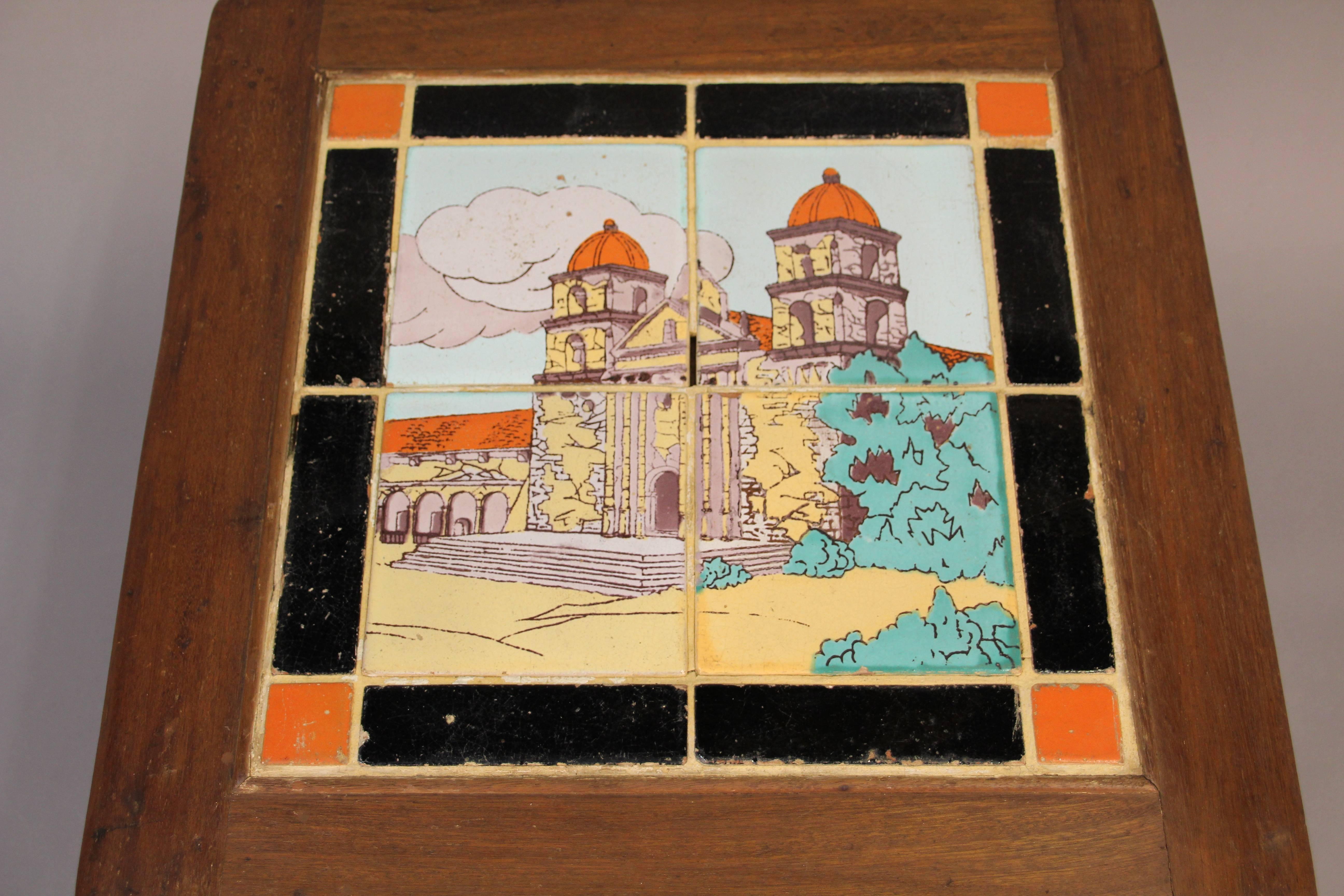 1930s tile table with tiles made by the Taylor Tile Cie bordered by black and orange field tiles. Scattered nicks and surface wear. Oakwood base.