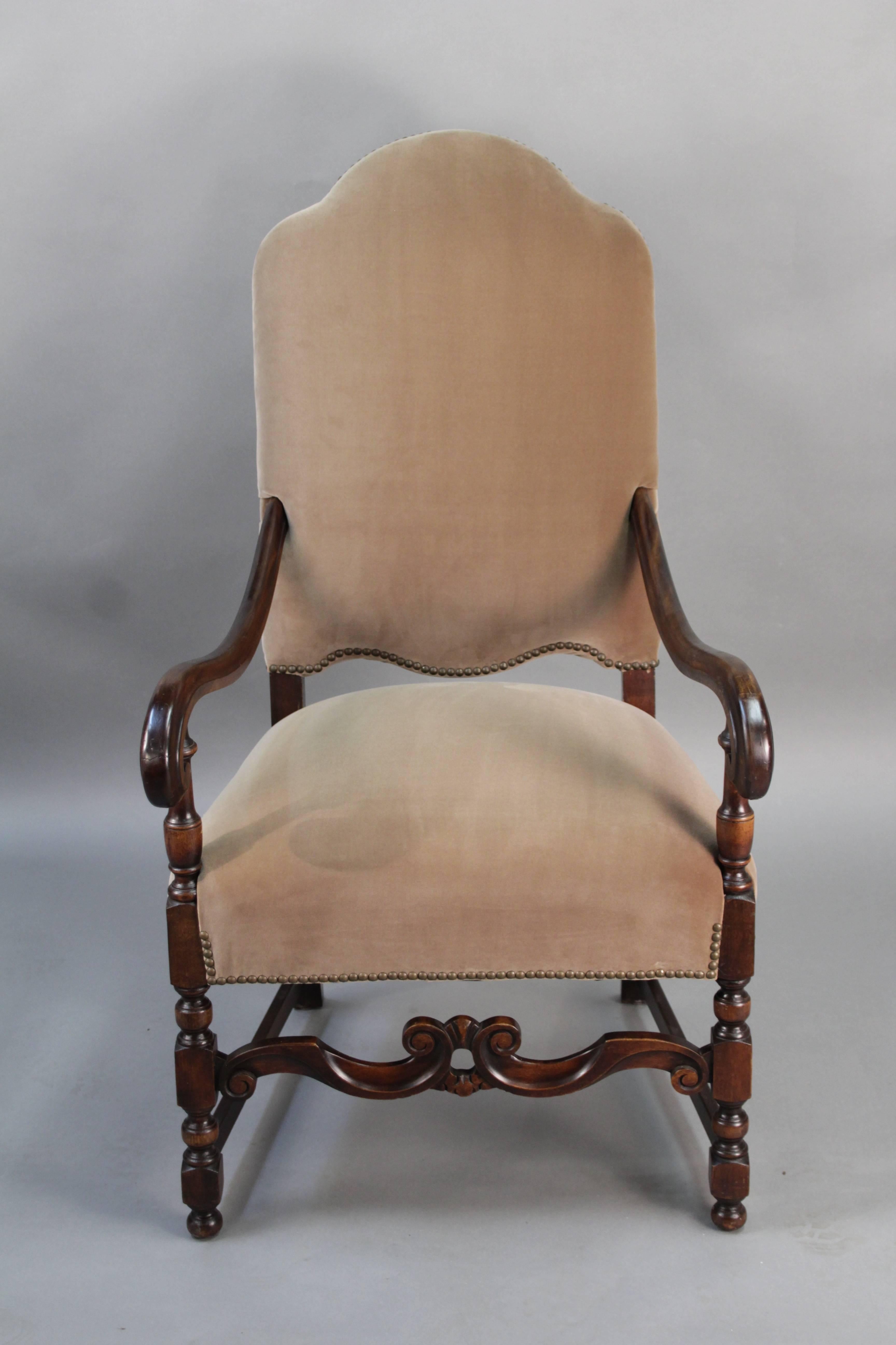 Armchair with new Belgian velvet upholstery, circa 1920s. Carved walnut frame.