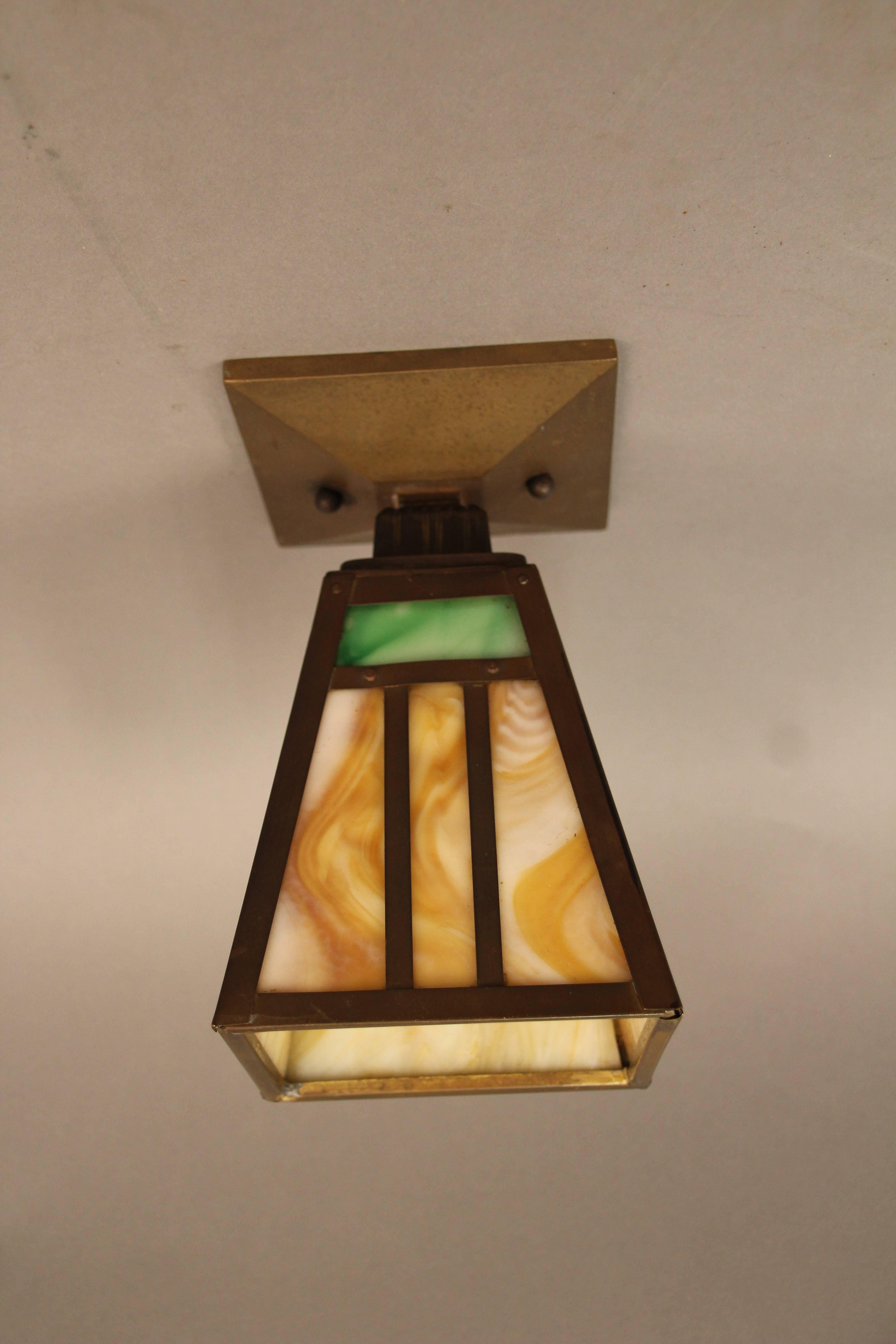 Signed Bradley and Hubbard ceiling mount with original patina and glass, circa 1910.