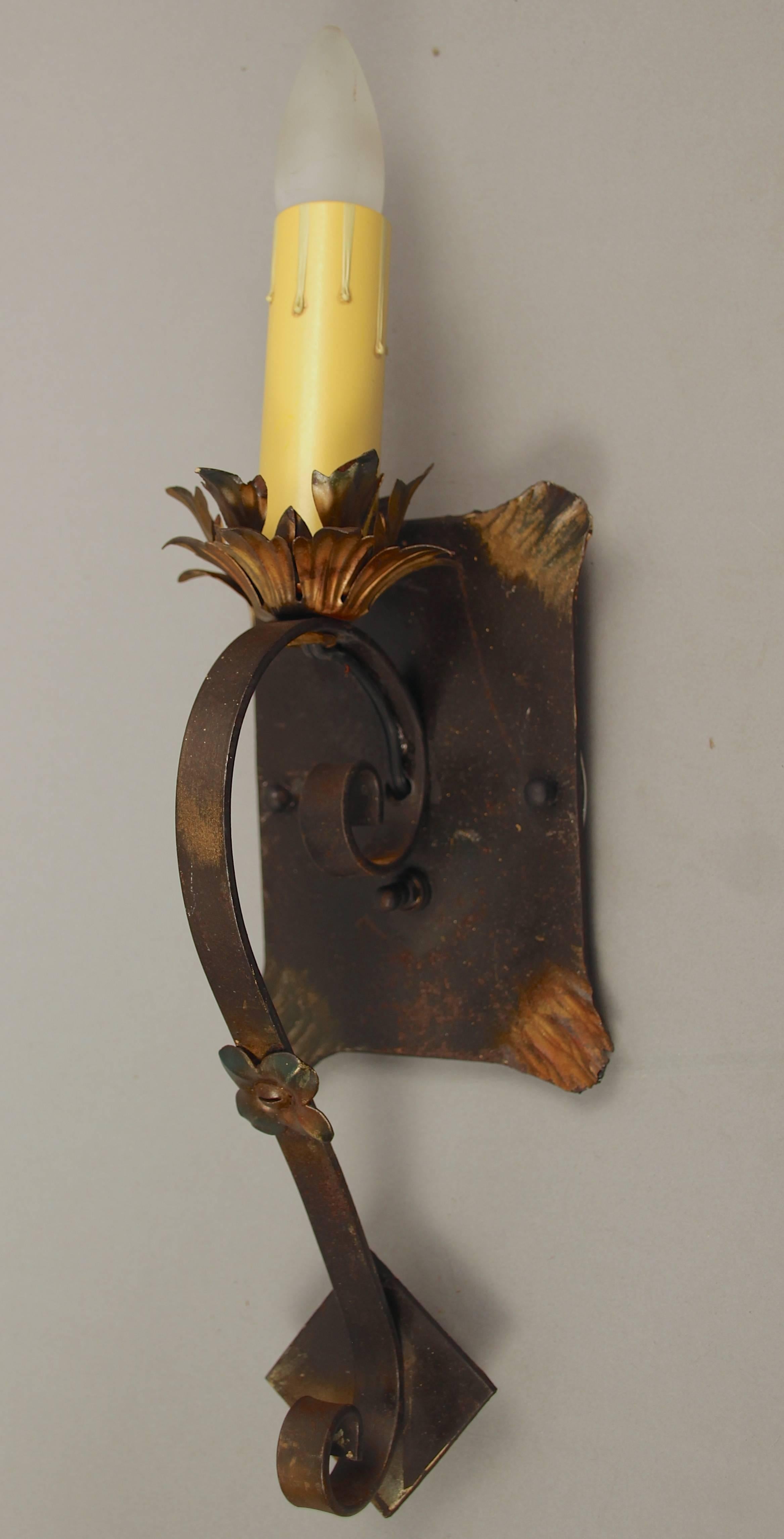1920s wrought iron sconces with original gold-tone accents and finish.