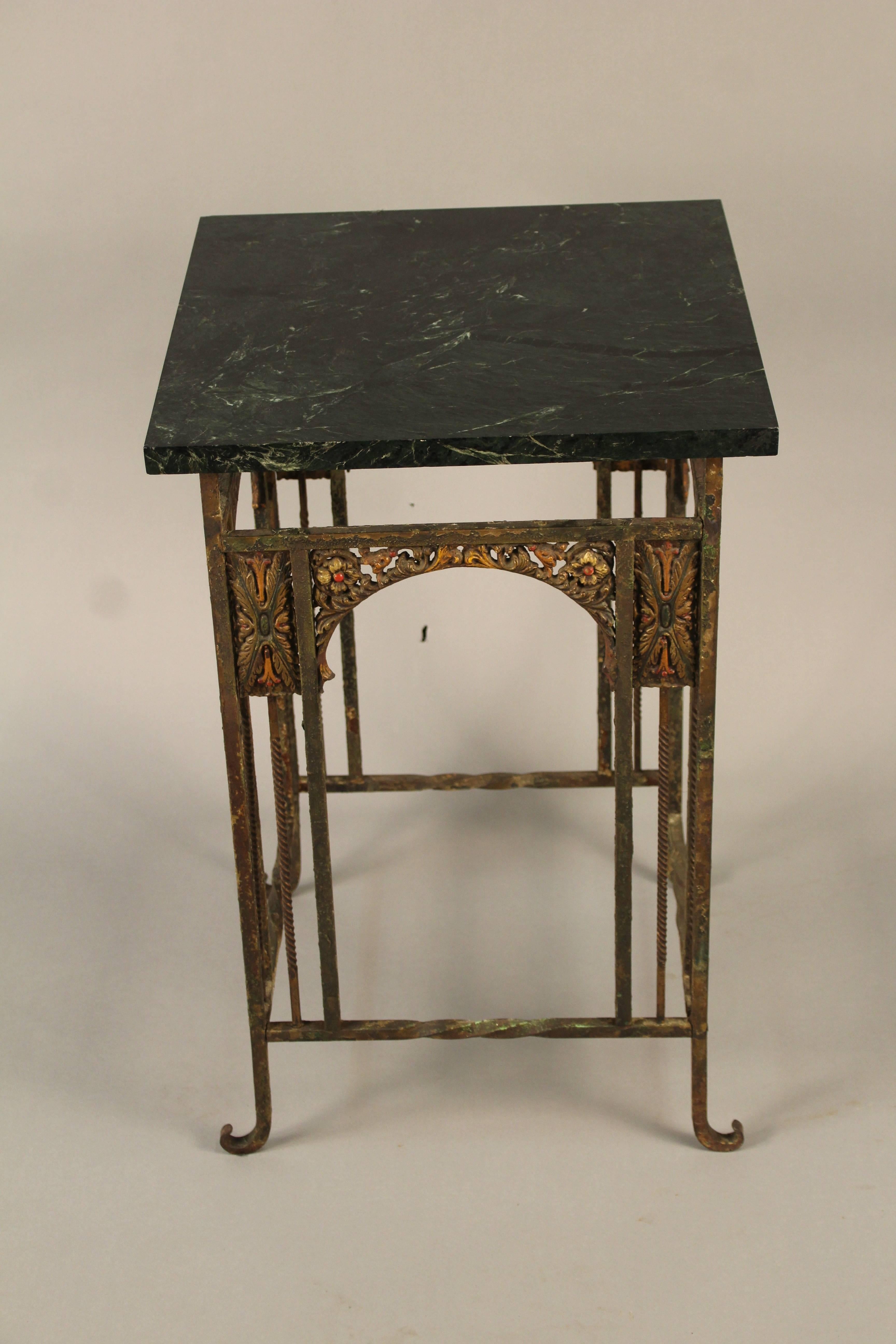 Handsome square side table with beautiful polychrome base and veined marble top.