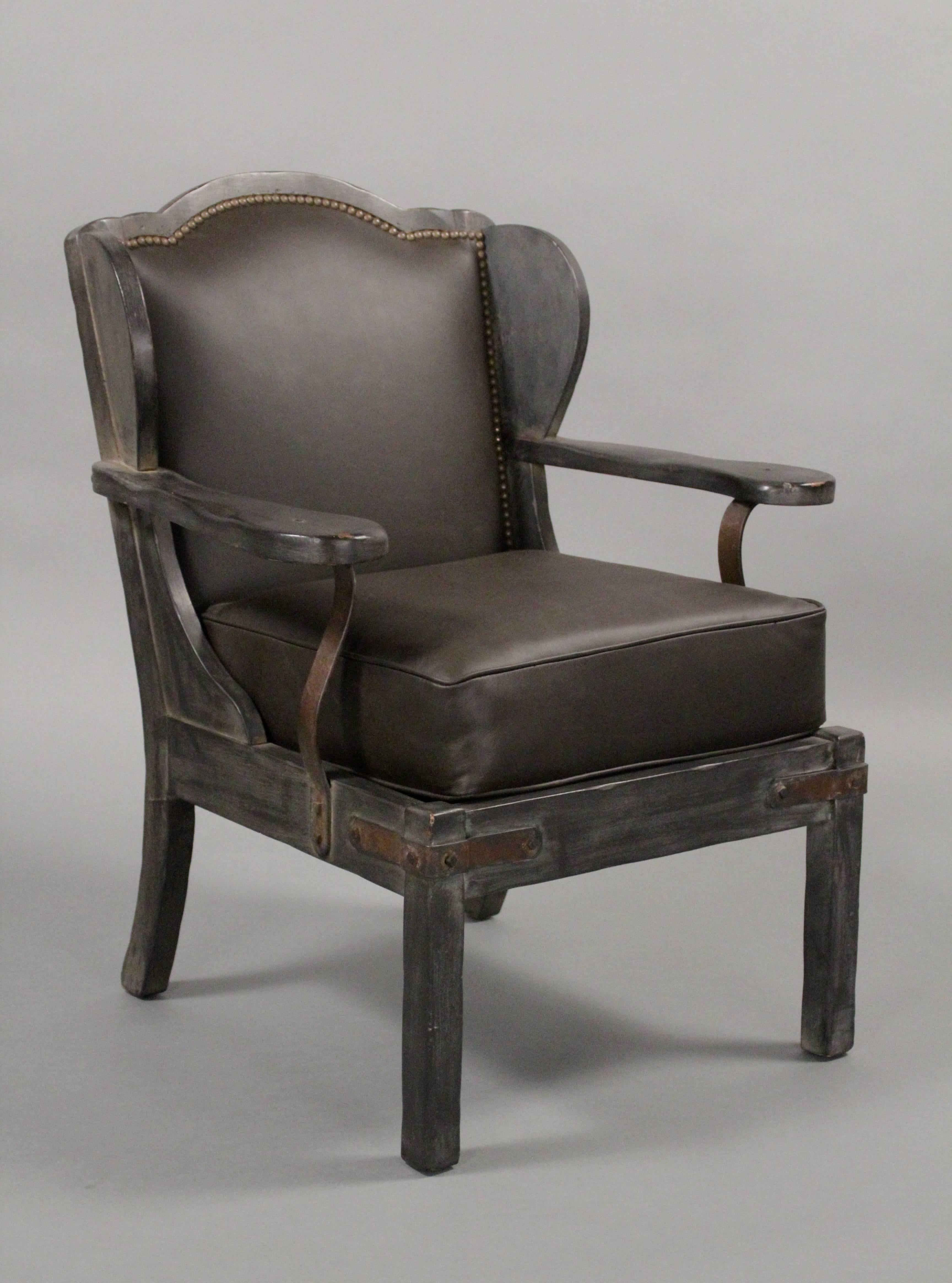 Rancho Monterey period wing back chairs with great iron strapping. Restored finish.