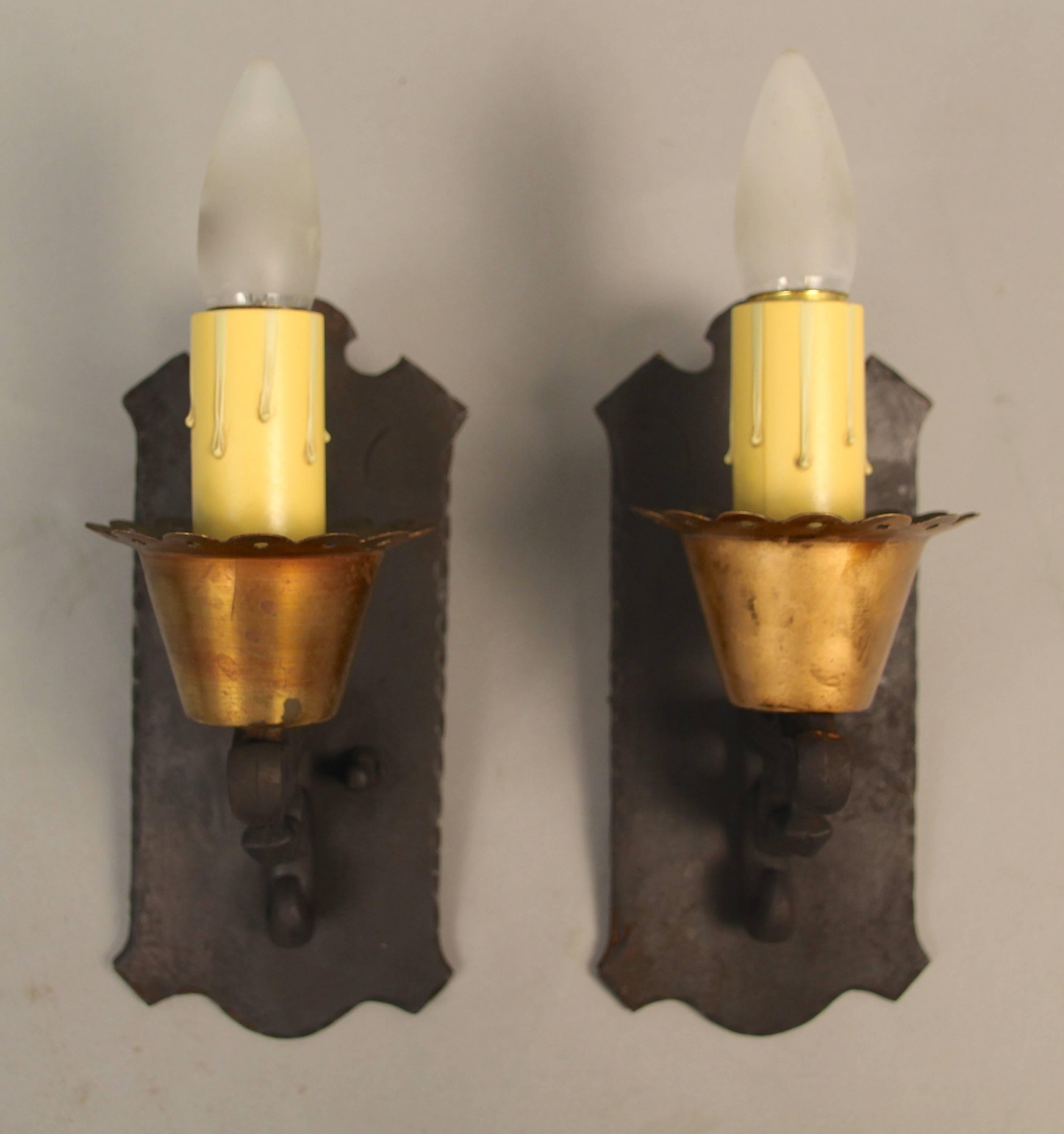 Classic antique pair of 1930s sconces would fit nicely in English Tudor, Spanish Revival and storybook homes. Measures: 9.5