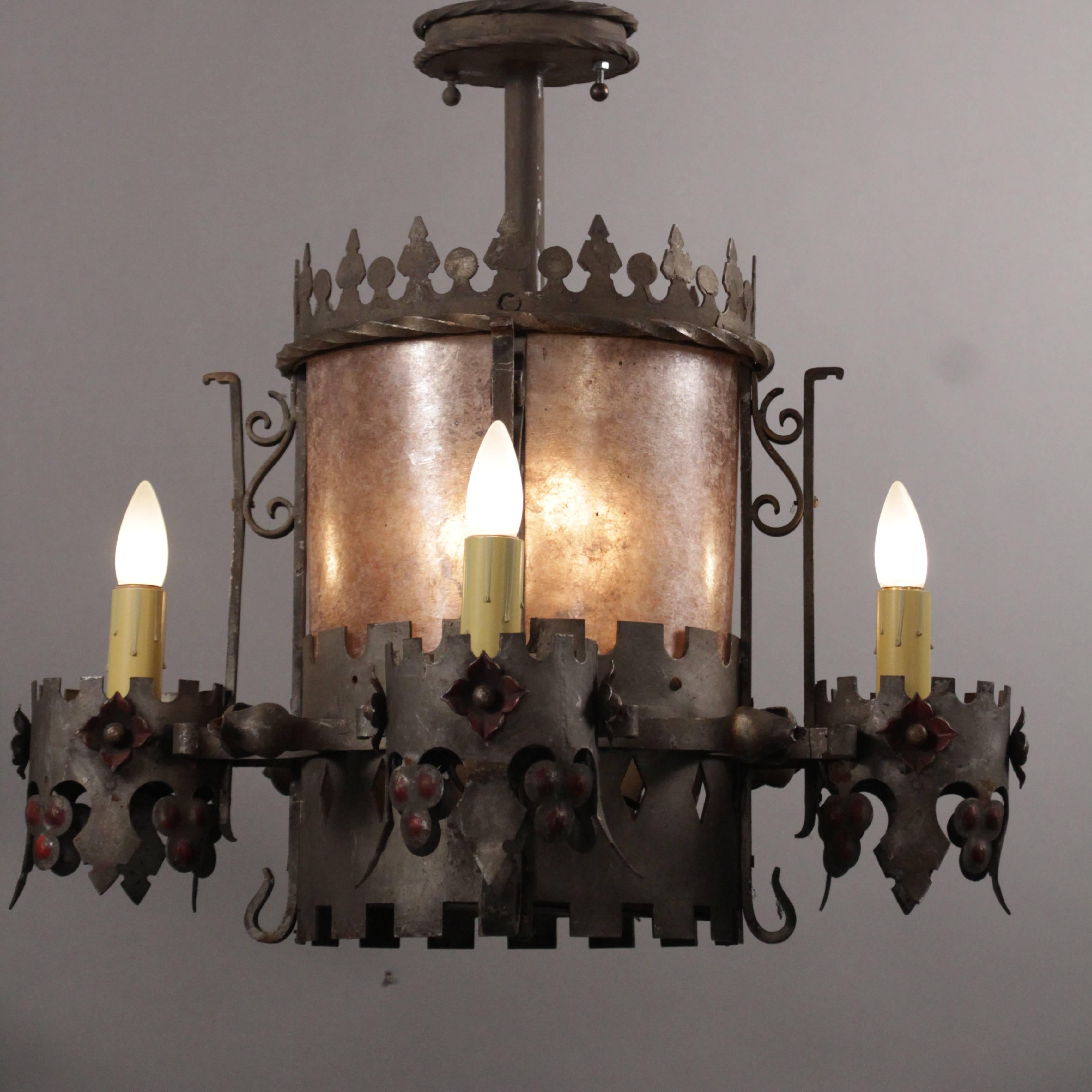 Chandelier with original polychrome finish and new almond mica, circa 1920s. Possibly from a theater, would fit nicely in English Tudor, Spanish Revival and Storybook architecture. Measure: 23.25