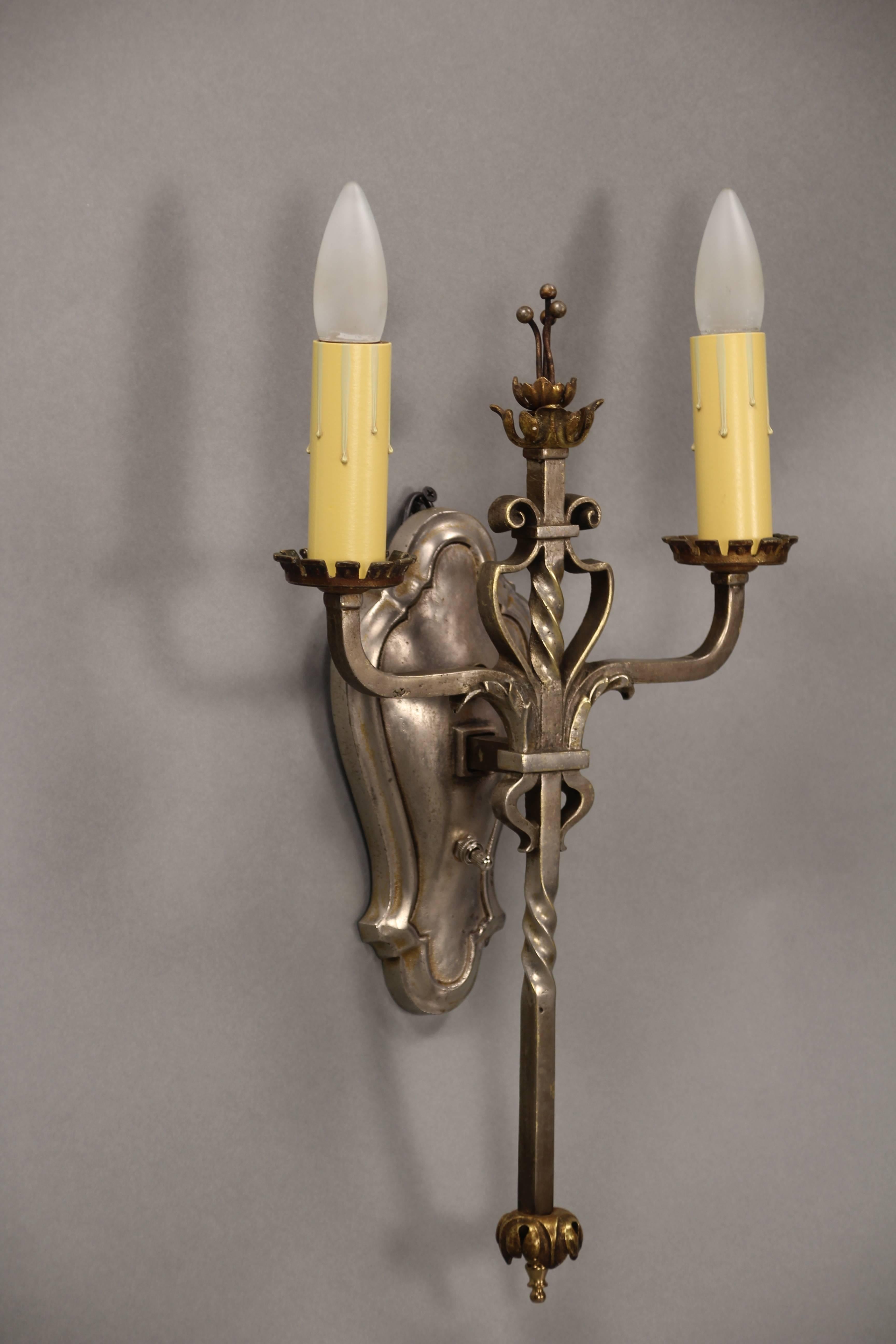 Hard to find two-toned 1920s sconces with silver and brass tone. Would fit nicely in Tudor and Spanish Revival homes.