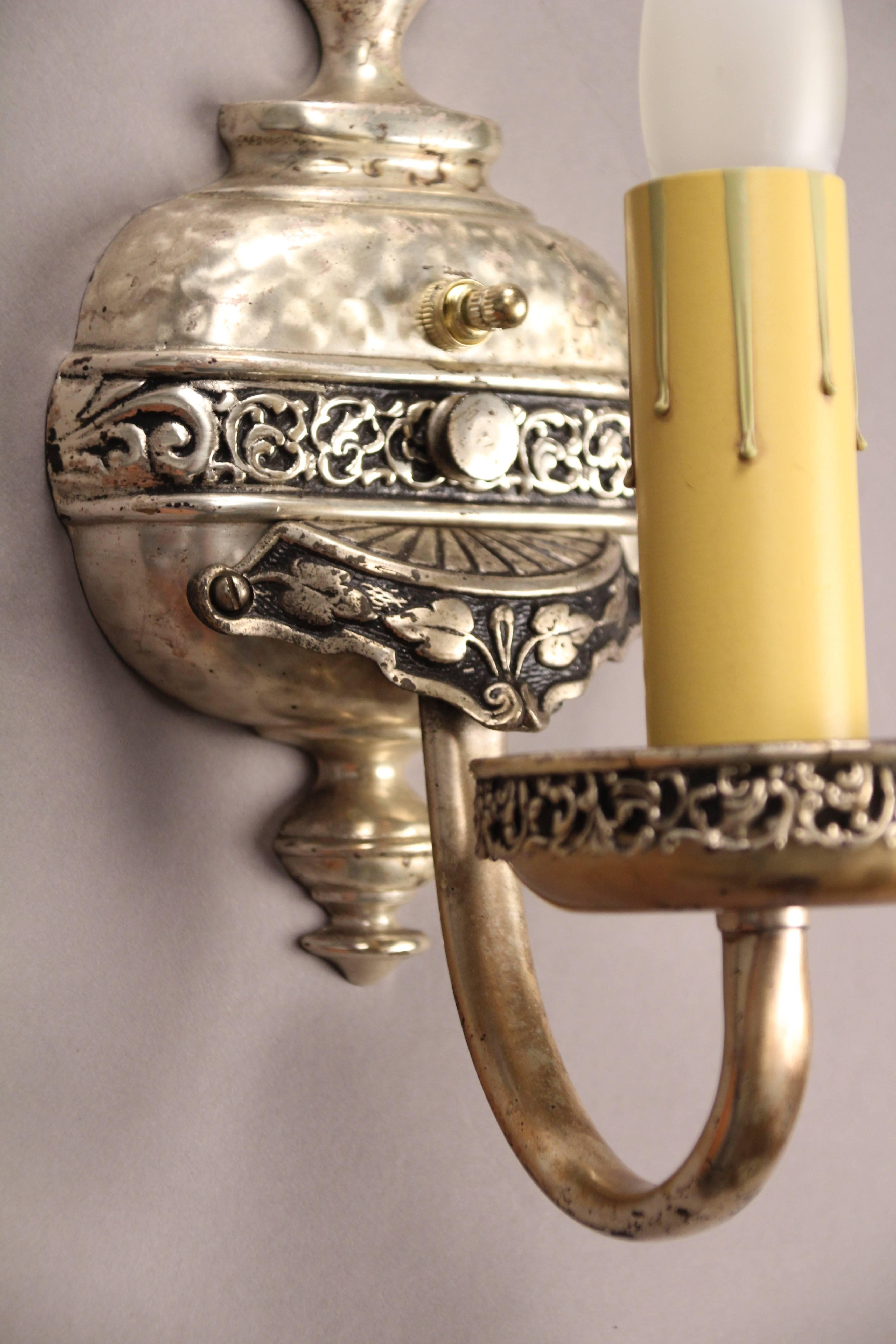 Sold and priced individually. Very nice single sconces with silver finish. Great casting, circa 1920s measure: 12.5